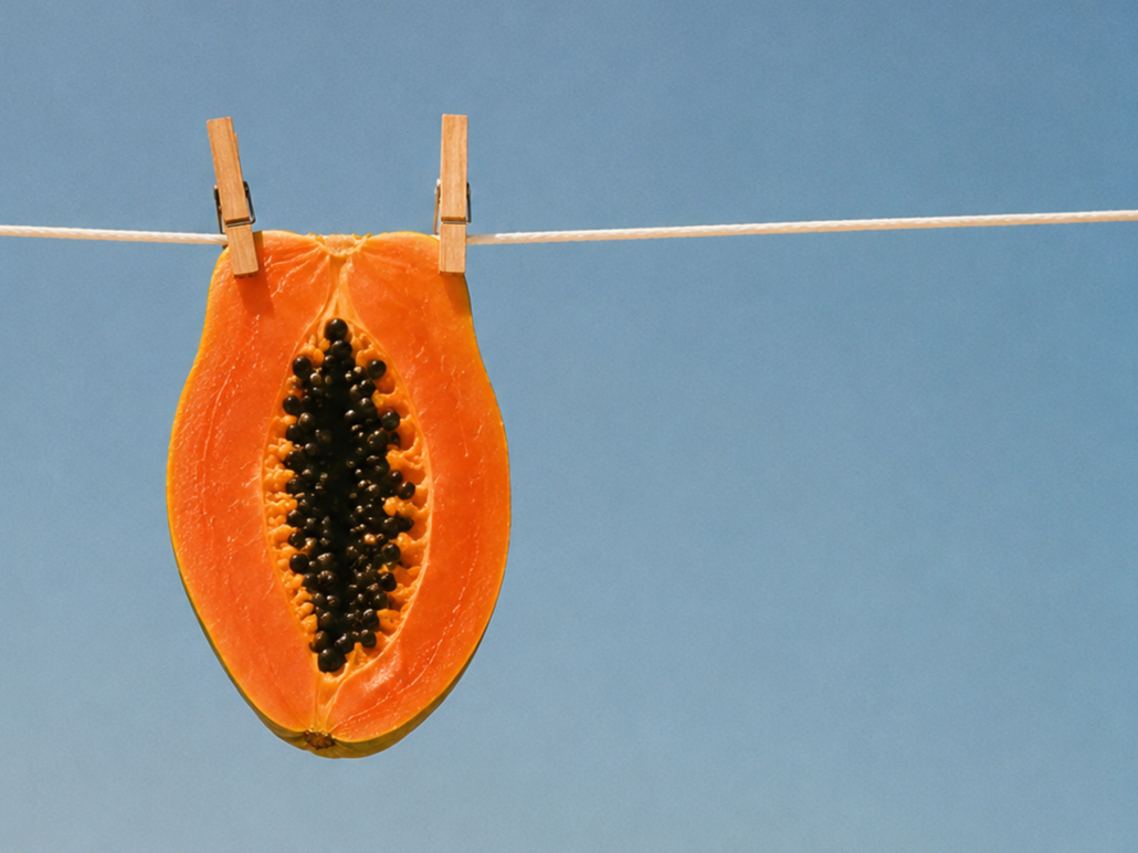 halved papaya hanging on a clothesline against 
blue sky, brand visual for Storytotellers 
creative consultancy beirut