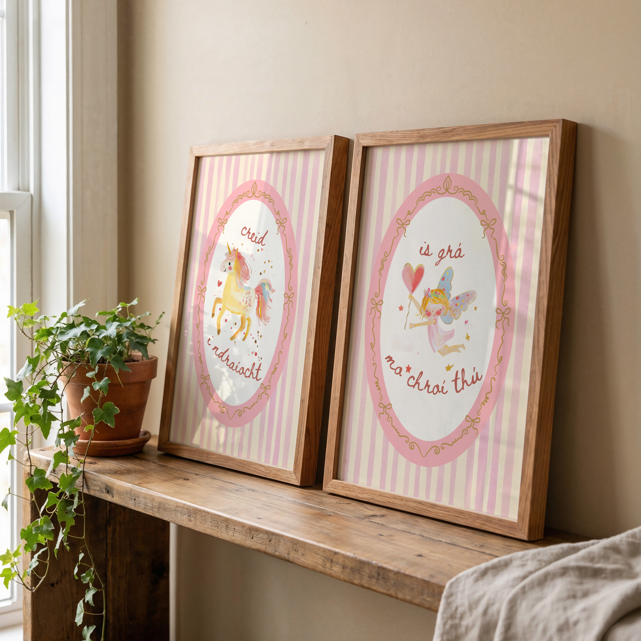 Irish language nursery playroom art work. featuring pink stripes and unicorns and fairies