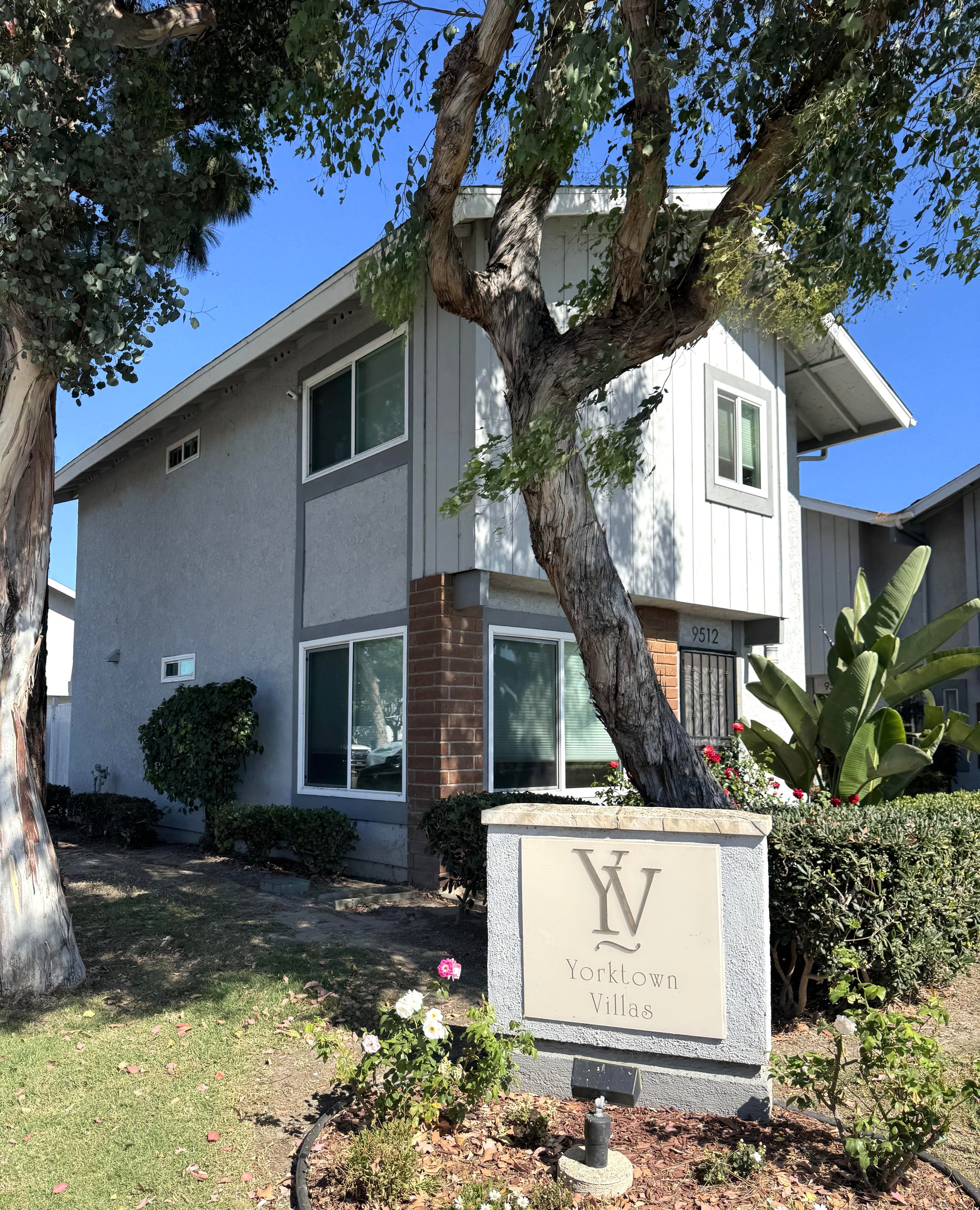 Yorktown Villas for sale in Huntington Beach, CA featuring the community entrance sign placard.
