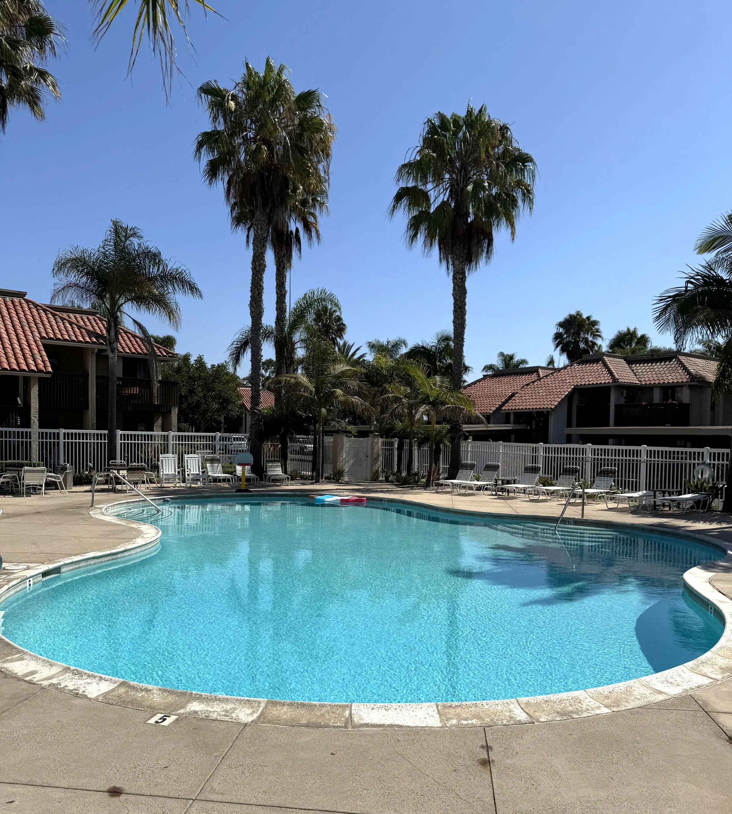 Las Brisas condos for sale in Huntington Beach, CA featuring the community pool.