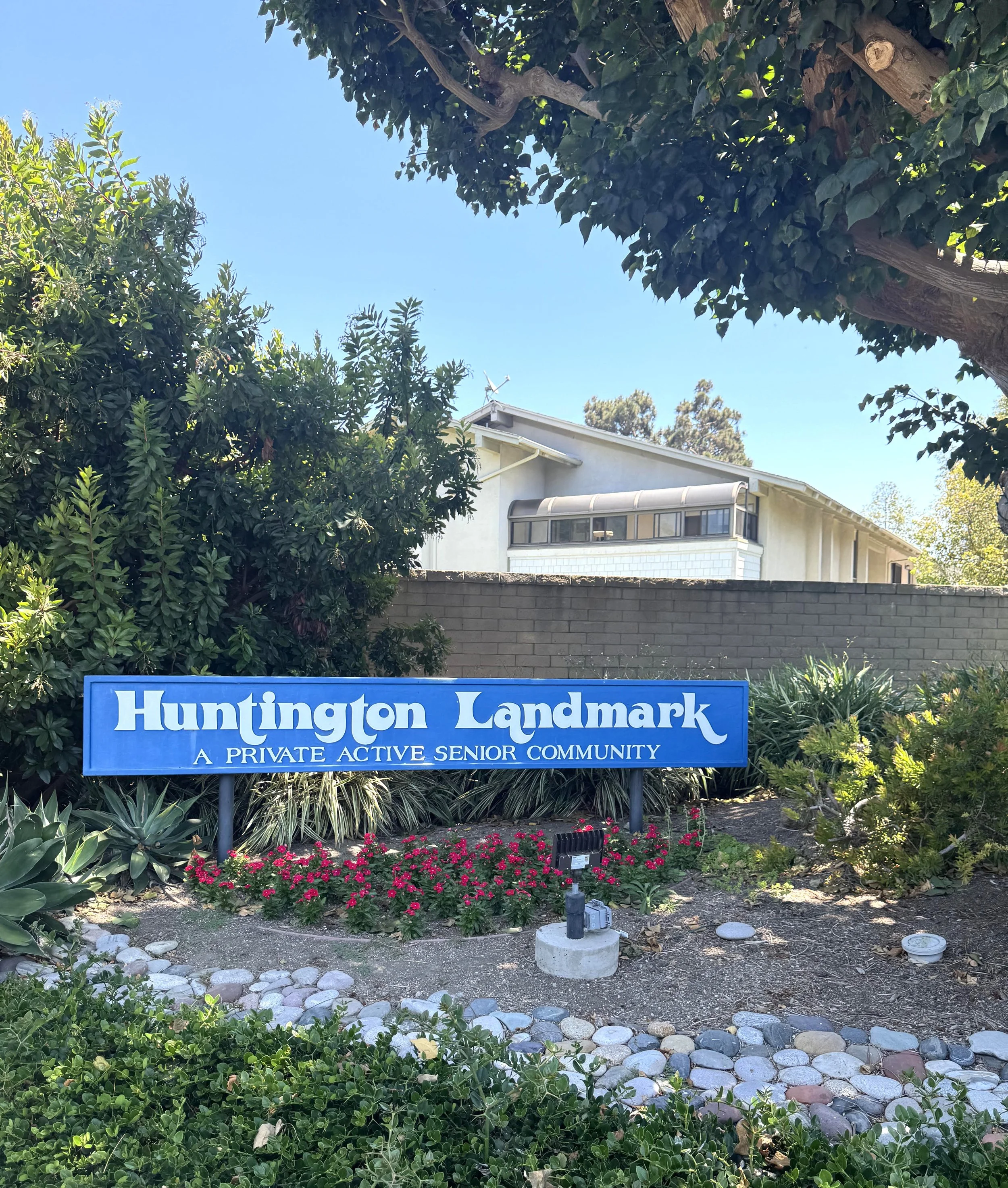 Huntington Landmark condos for sale in Huntington Beach featuring the community entrance sign placard.