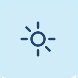 Simple icon of a sun with rays on a light blue background.