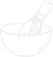 A whisk in a mixing bowl