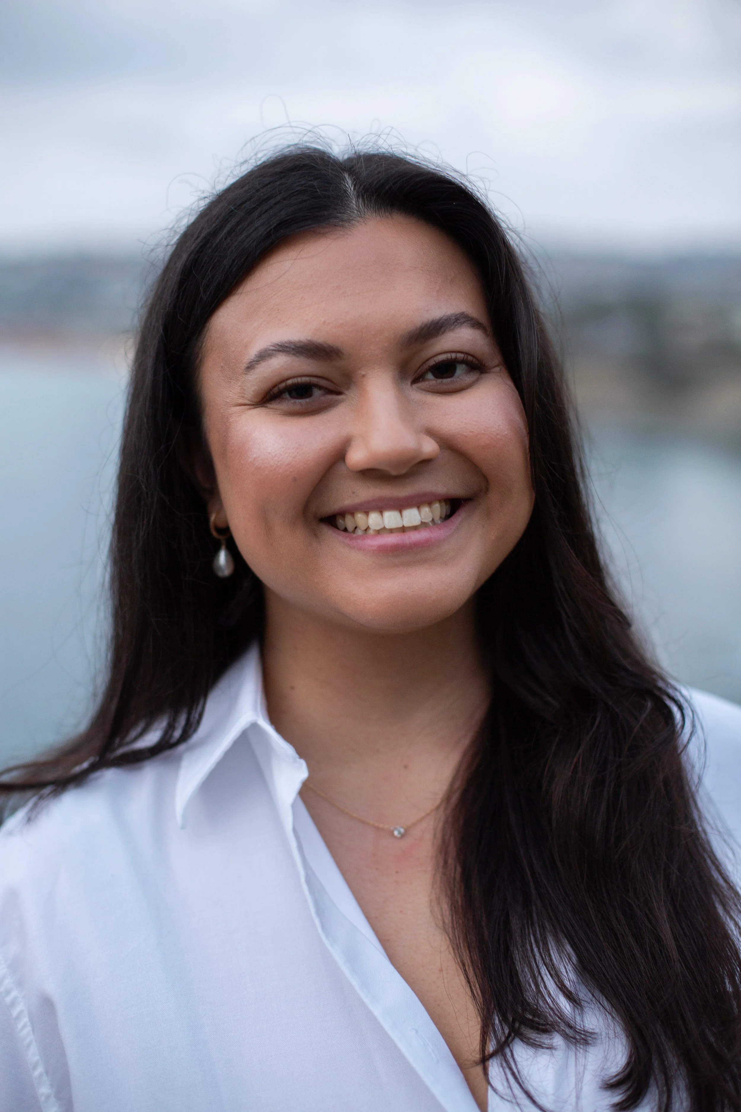 Marisa Dao, Licensed Professional Clinical Counselor, smiling warmly in a white button up blouse.