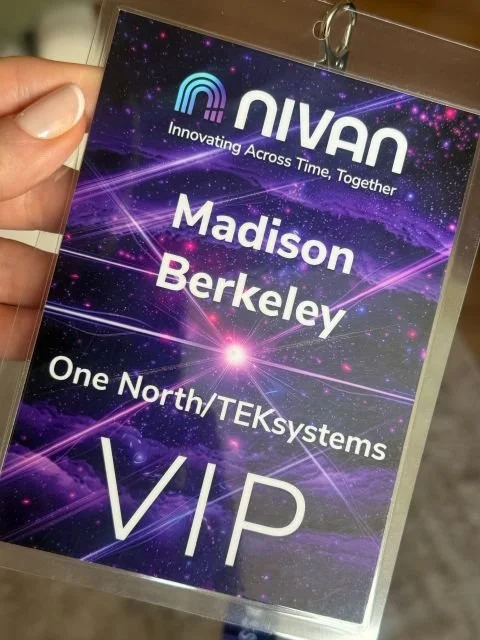 A VIP badge with a futuristic galaxy design, the Nivan logo, the name Madison Berkeley, and the company One North/TEKsystems.
