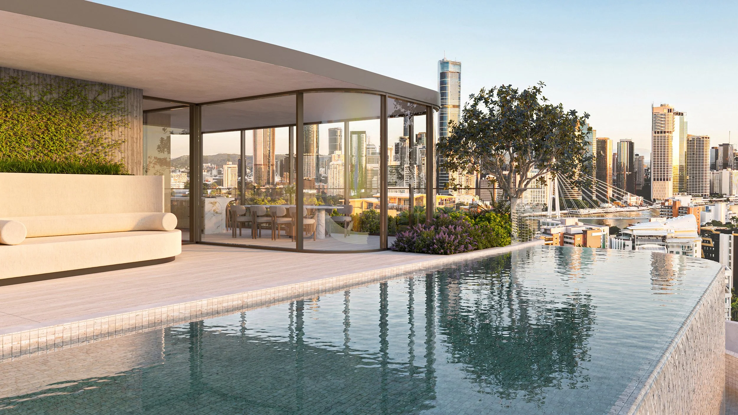 Banksia Kangaroo Point. Joe Adsett Designed. Rooftop infinity pool overlooking a city skyline with high-rise buildings and a bridge, modern outdoor seating and greenery.