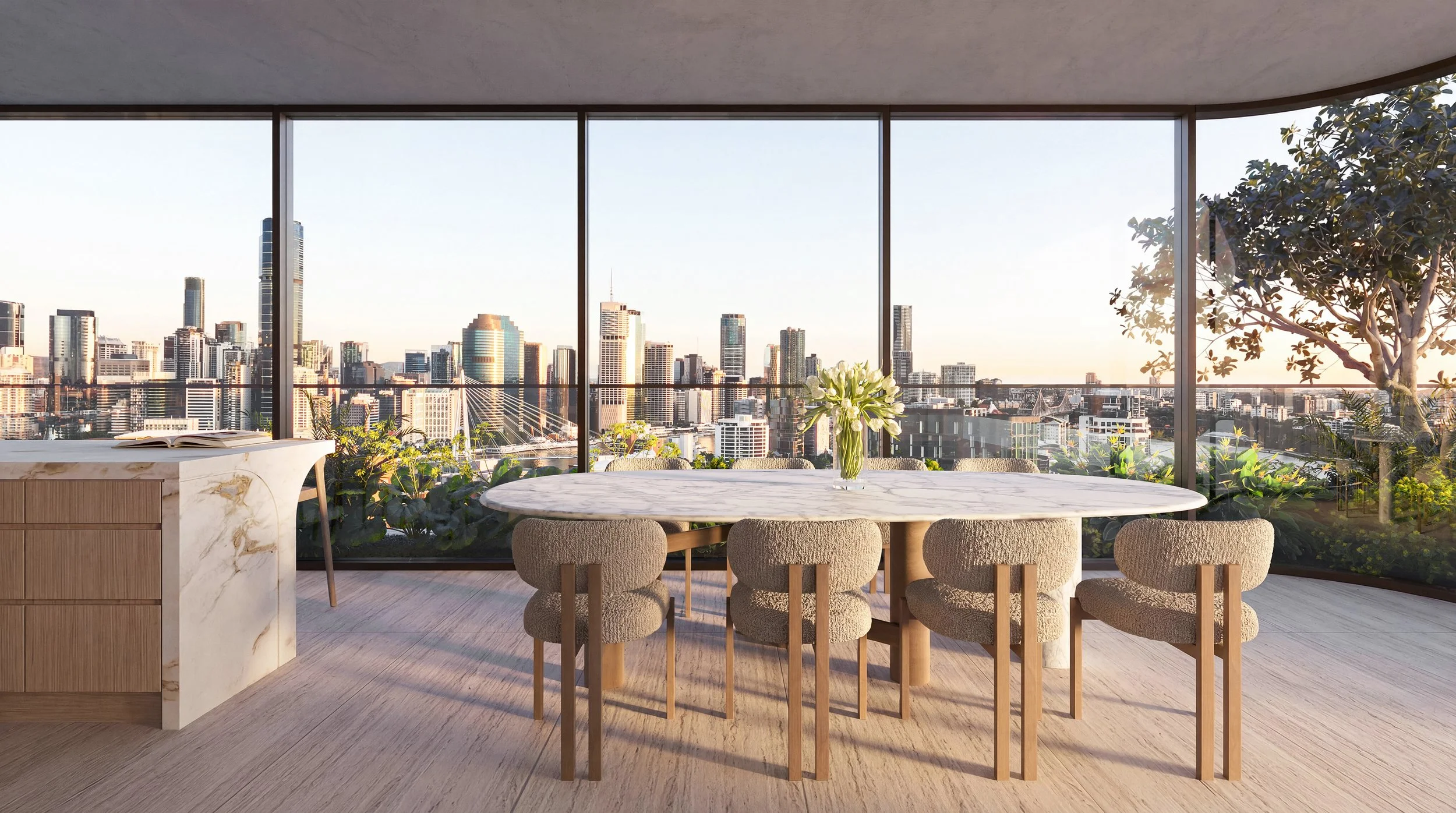 Banksia Kangaroo Point. Joe Adsett Designed. Modern dining area with a round marble table and eight upholstered chairs, large windows with a city skyline view, plants, and a vase with flowers on the table.