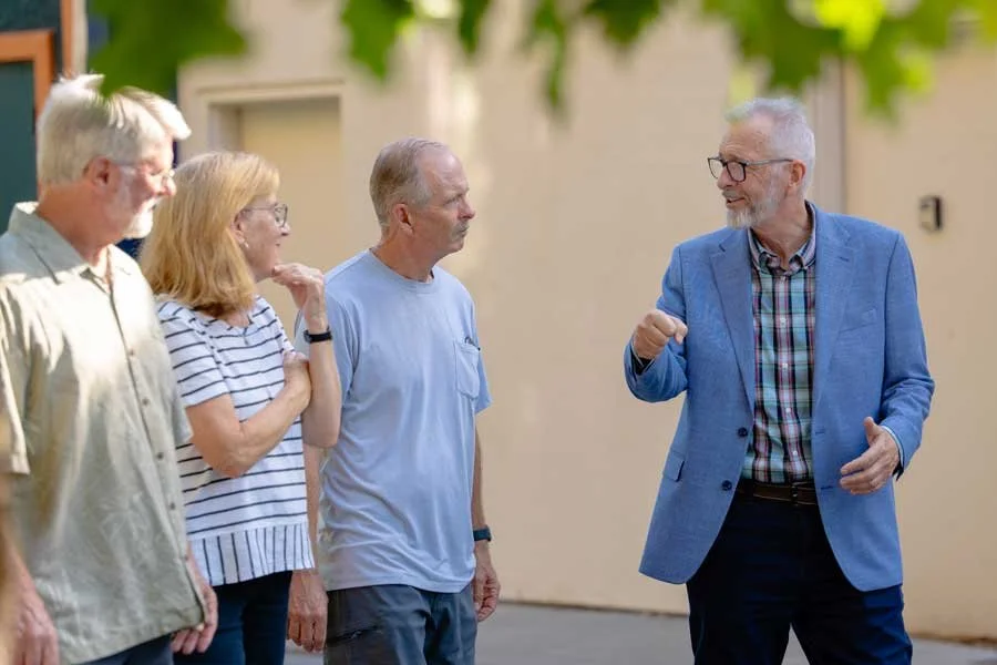 Russ Wenham running for Redding City Council talking with friends in town