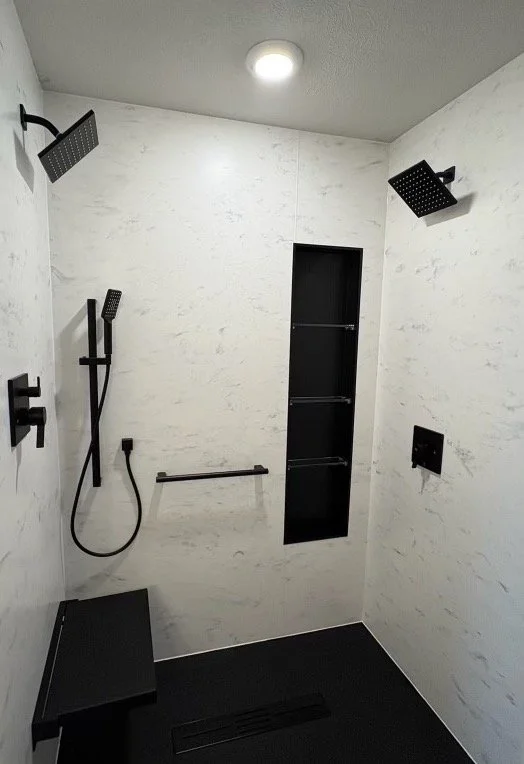 dual-rainhead-shower-marble-walls-black-bench-linear-drain-pittsburgh-pennsylvania.jpg