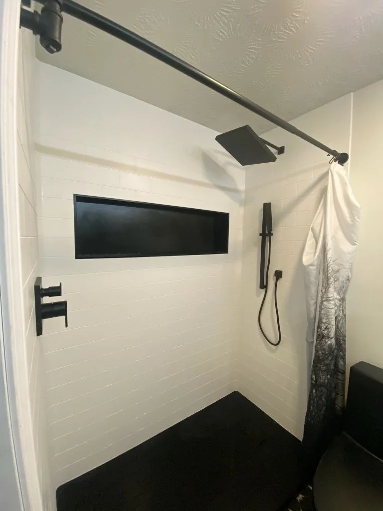black-fixture-tub-to-shower-conversion-horizontal-niche-northeast-ohio.jpg