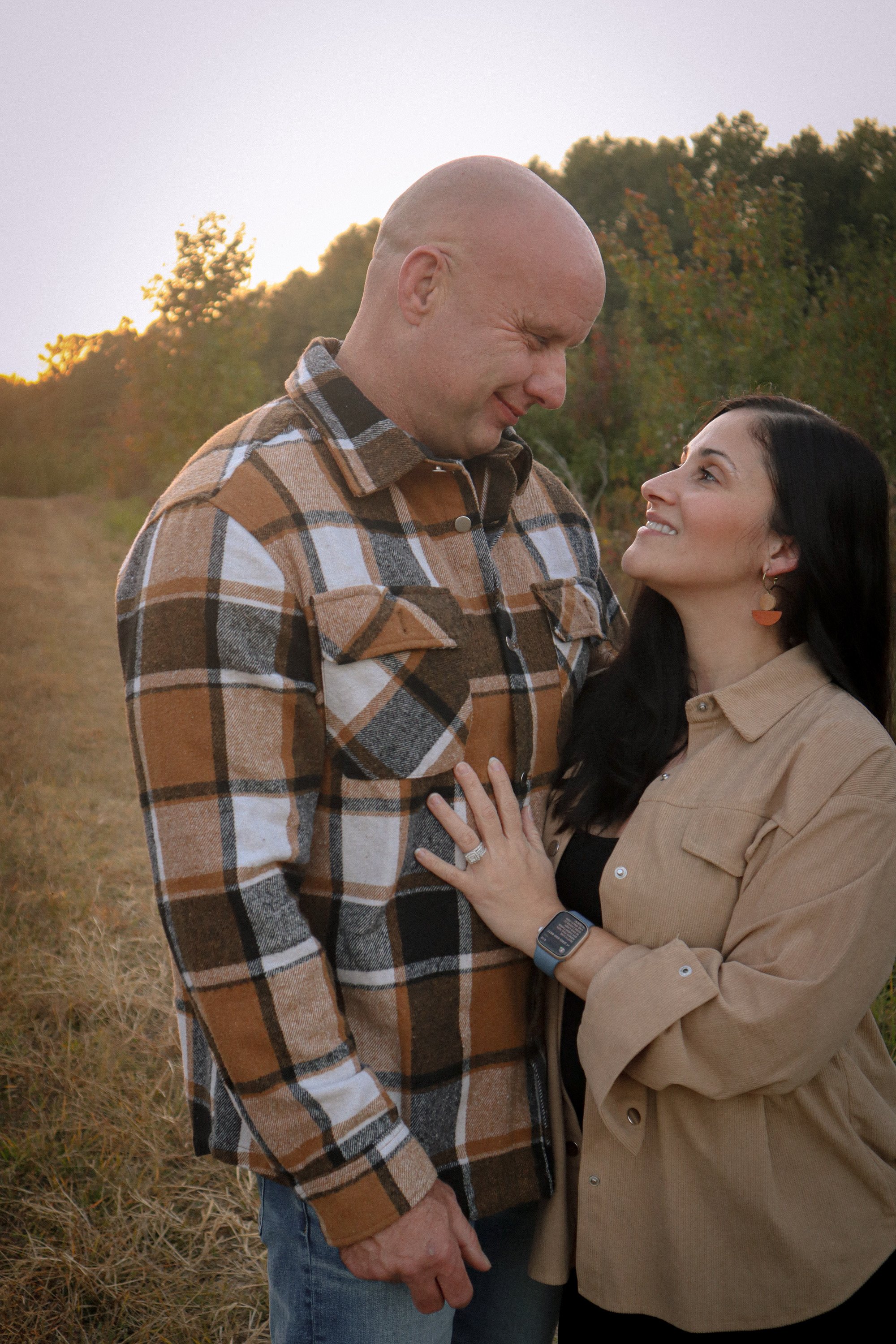 Couple sharing a moment together during a golden hour fall photography session.
