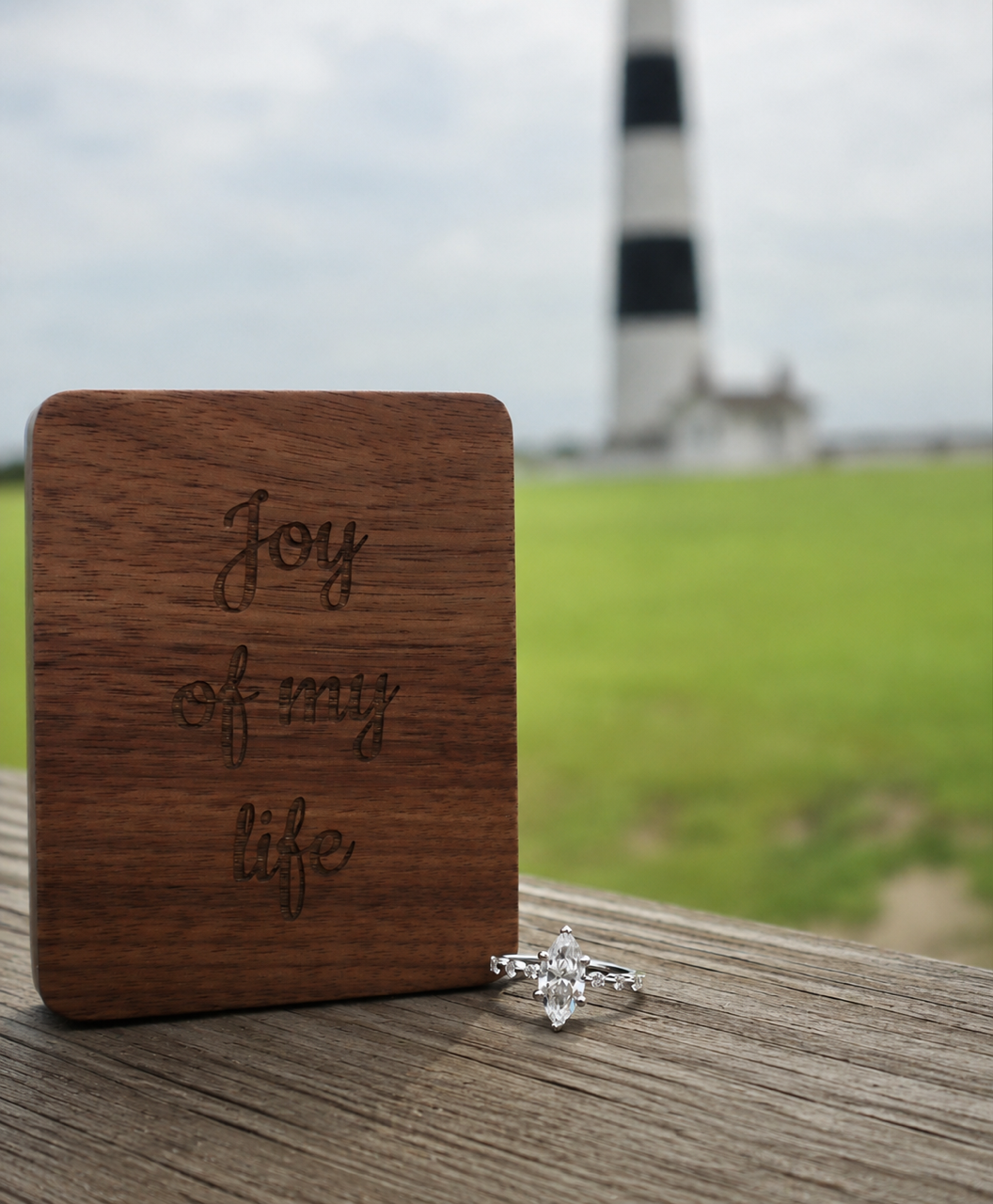 Close-up detail photograph of an engagement ring during a couples photography session