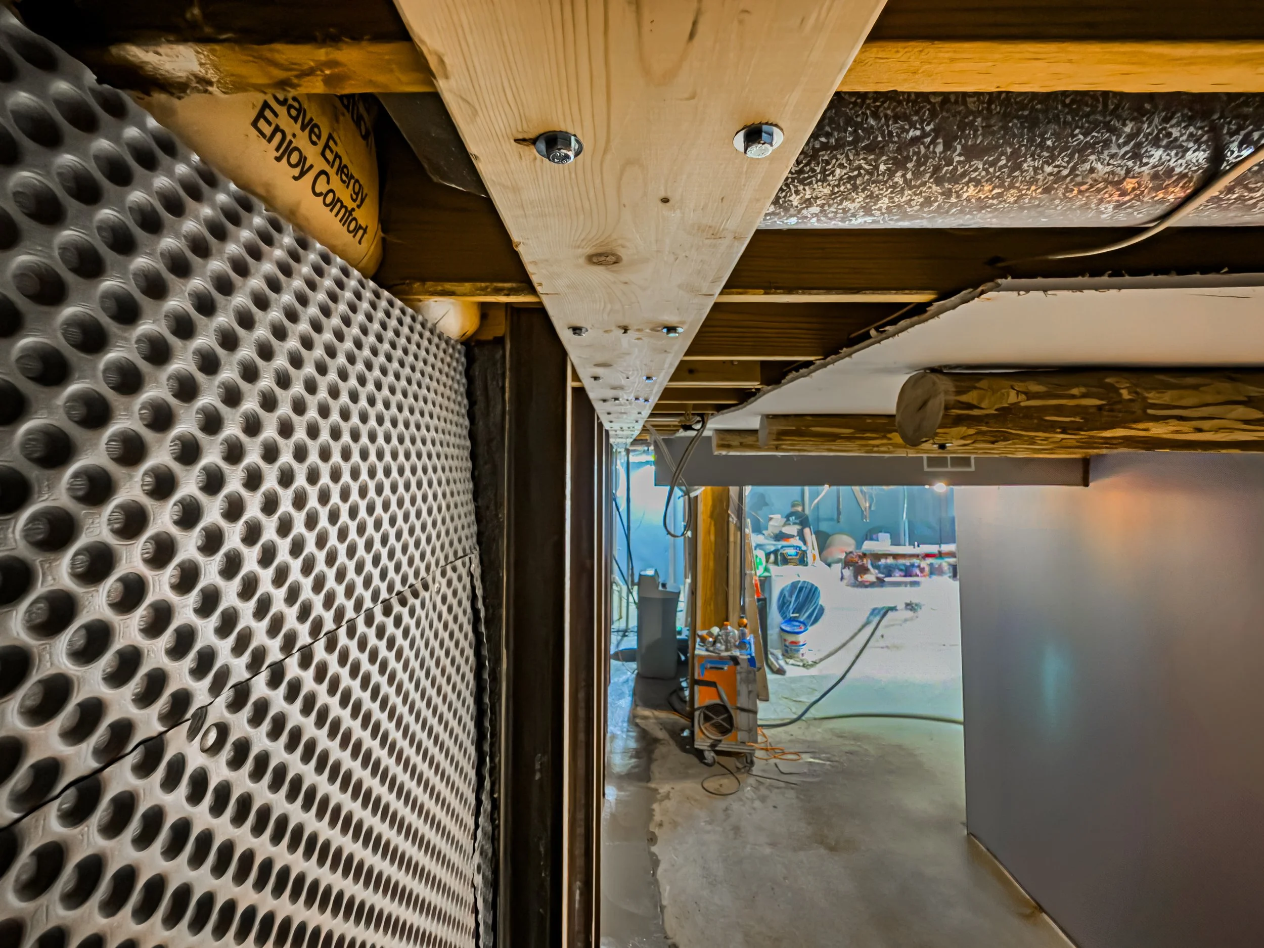 photo of floor joists being stabilized