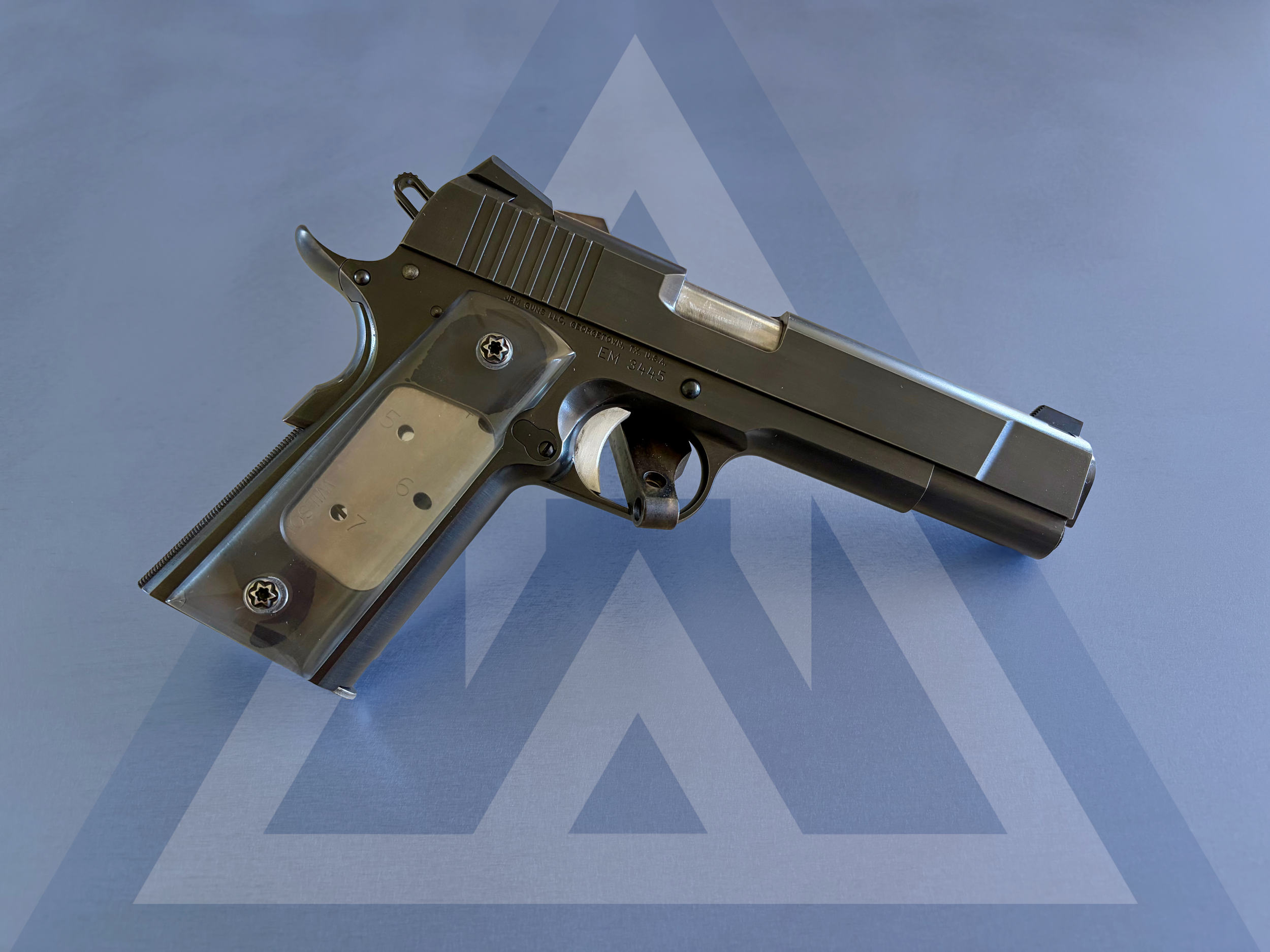 Custom 1911: Built on a JEM frame and slide, Kart barrel. Blued finish.