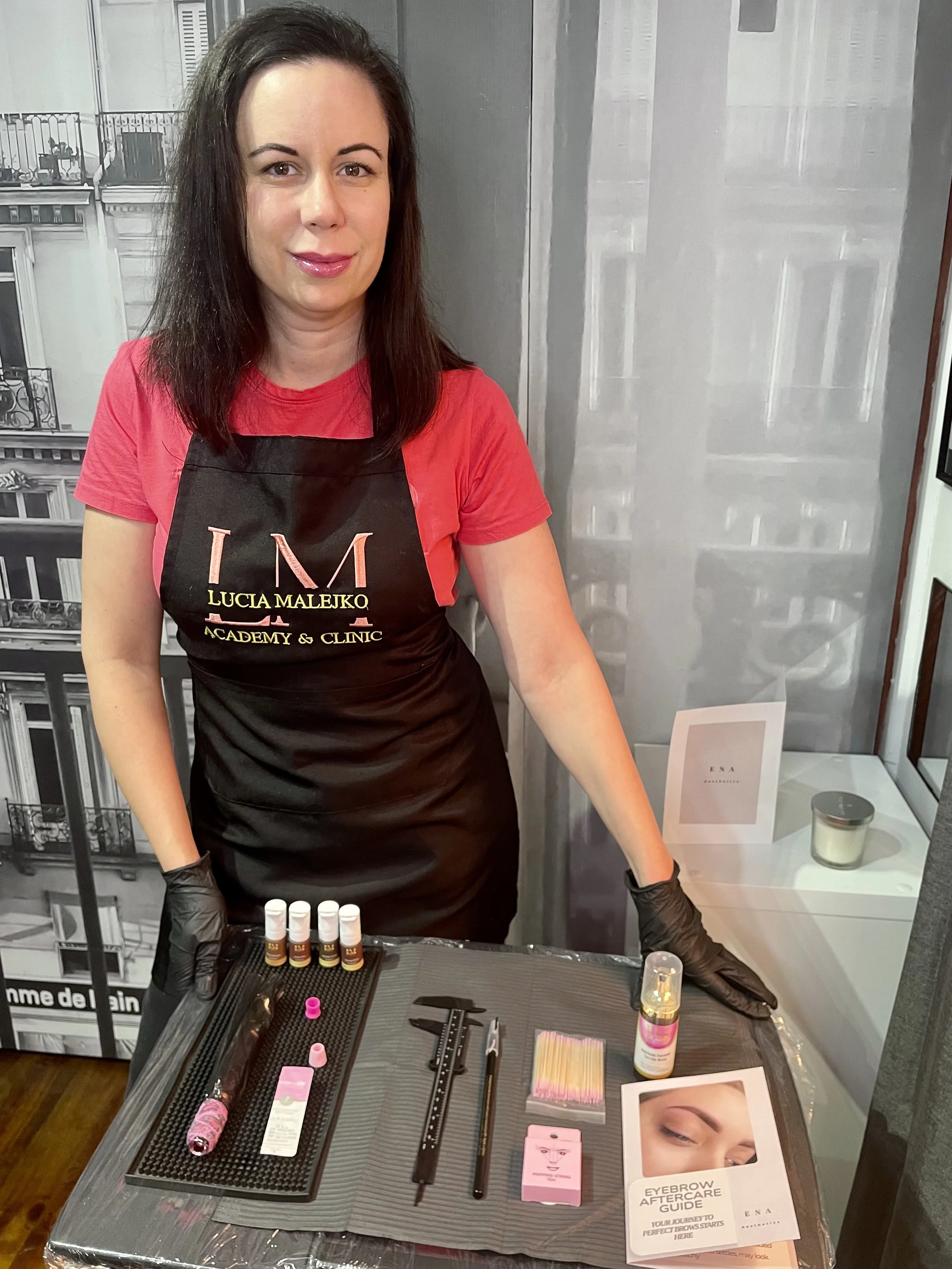 ENA Piroska, cosmetic eyebrow tattoo artist and founder of ENA Aesthetics, preparing for a personalised brow consultation with meticulous attention to hygiene, facial harmony and natural-looking results.