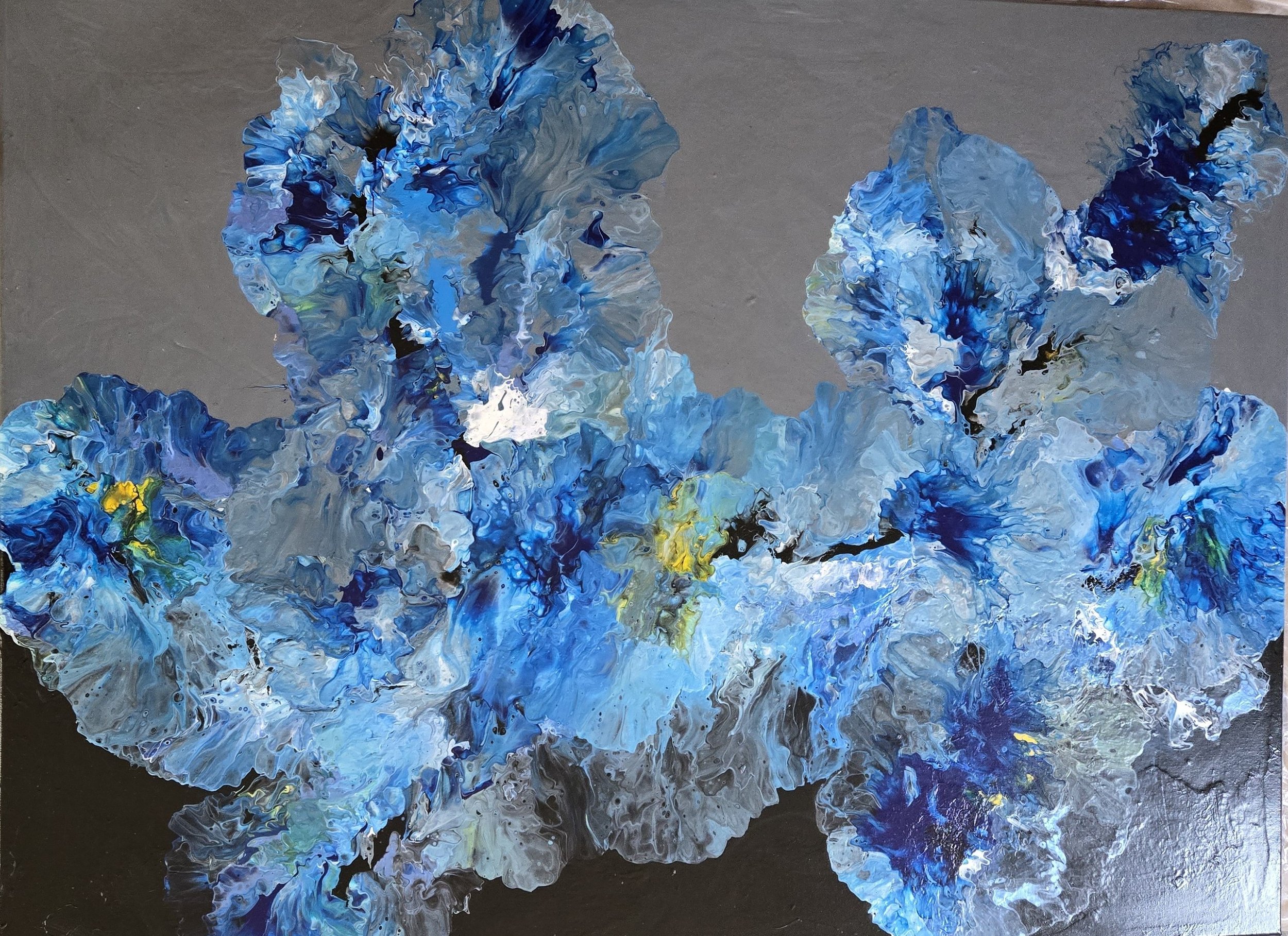 Abstract painting with blue, white, and gray swirling colors on a gray background