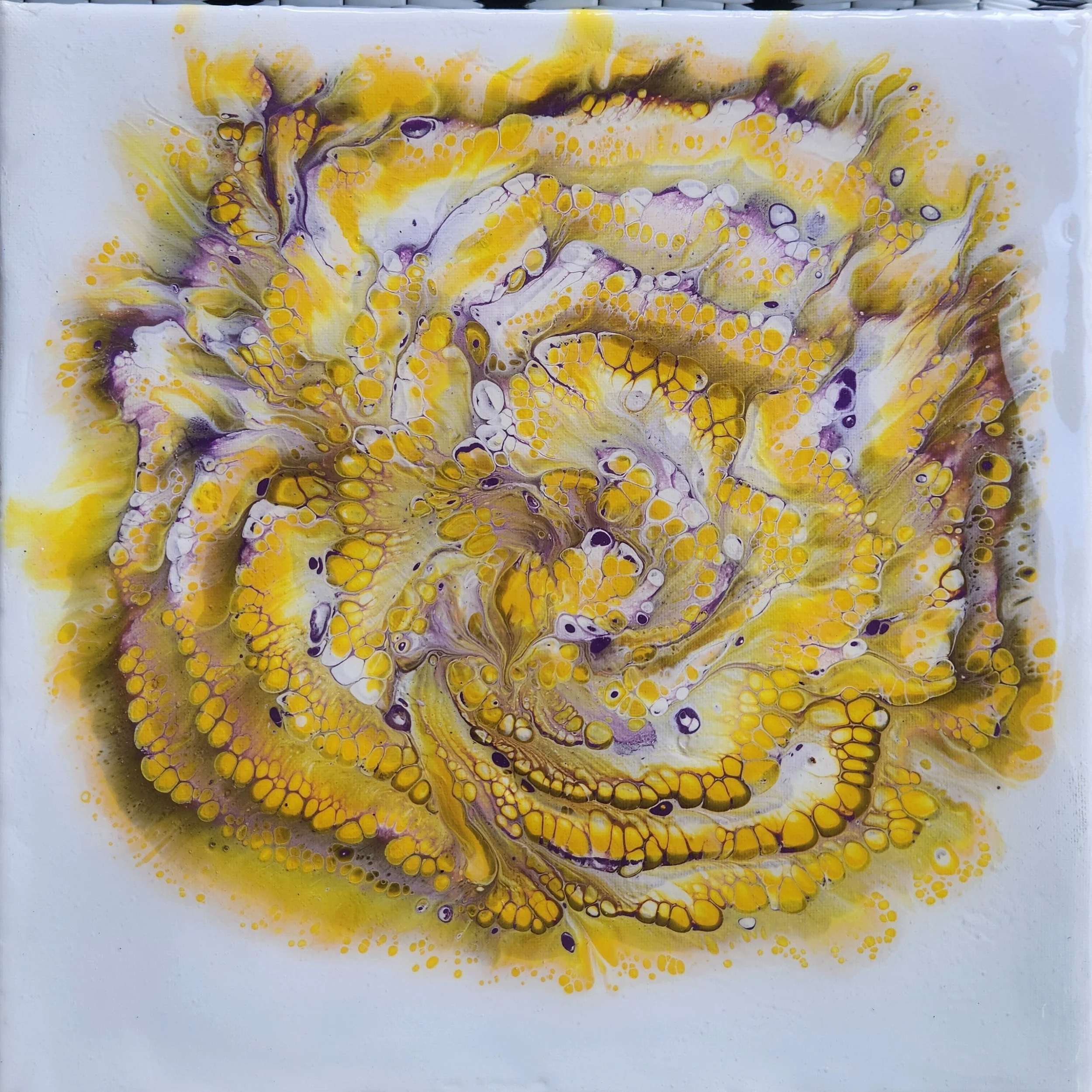 Abstract painting with yellow, purple, black, and white colors forming swirling and dotted patterns.