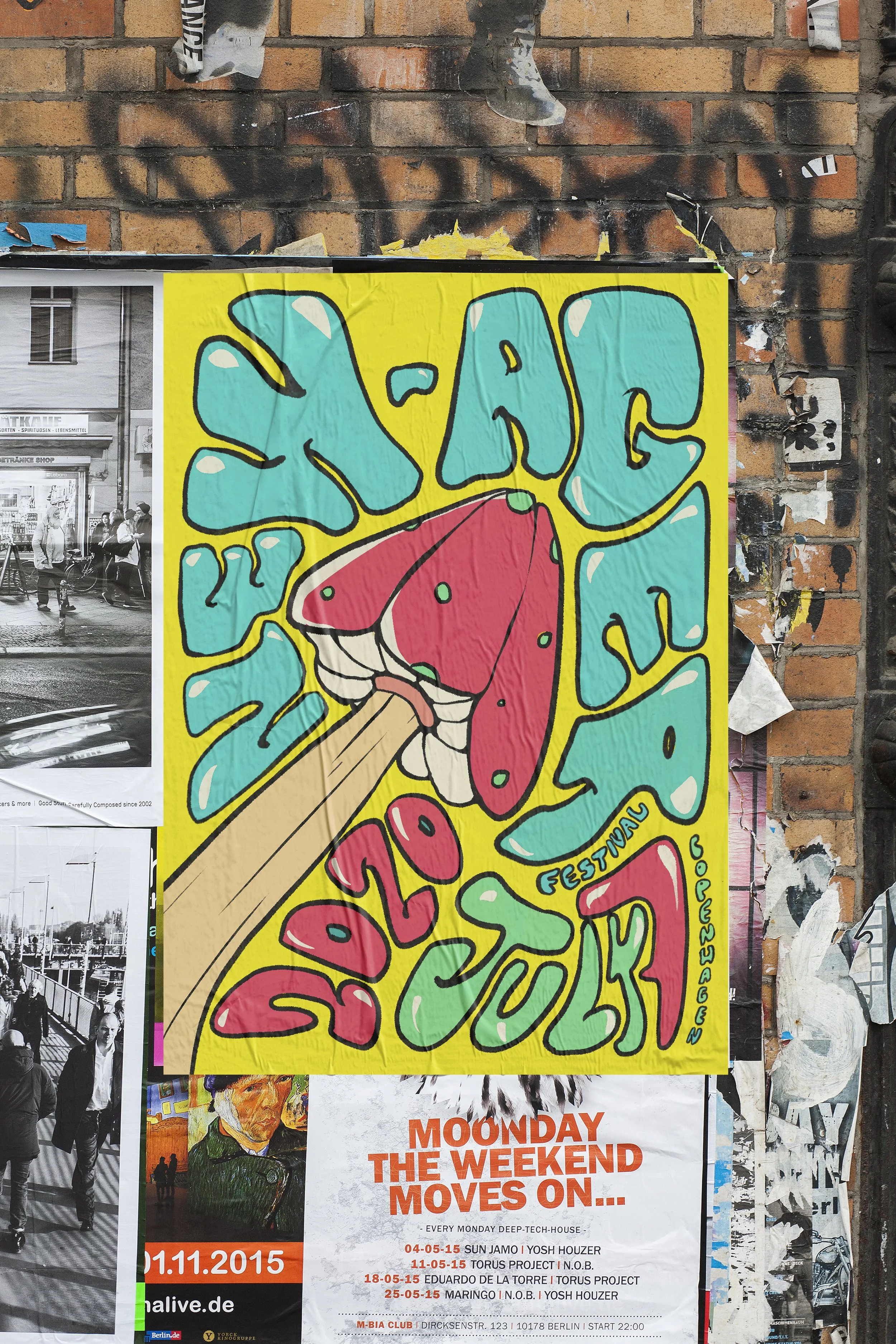 A colorful poster on a brick wall advertising a music festival with dates and artists, partially obscured by other black-and-white posters. The top part of the poster features large, artistic lettering with a hand holding a megaphone or horn, set aga