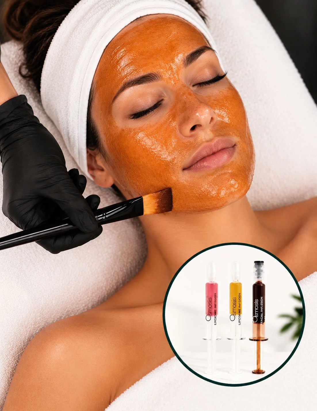 A woman receiving a facial treatment with a golden-orange mask applied to her face, lying on a spa bed with a white headband and towel. An esthetician wearing black gloves applies the mask with a brush. Inset shows three ampoules labeled 'exosome,' 'liposome,' and 'facial infusion' for skin care.