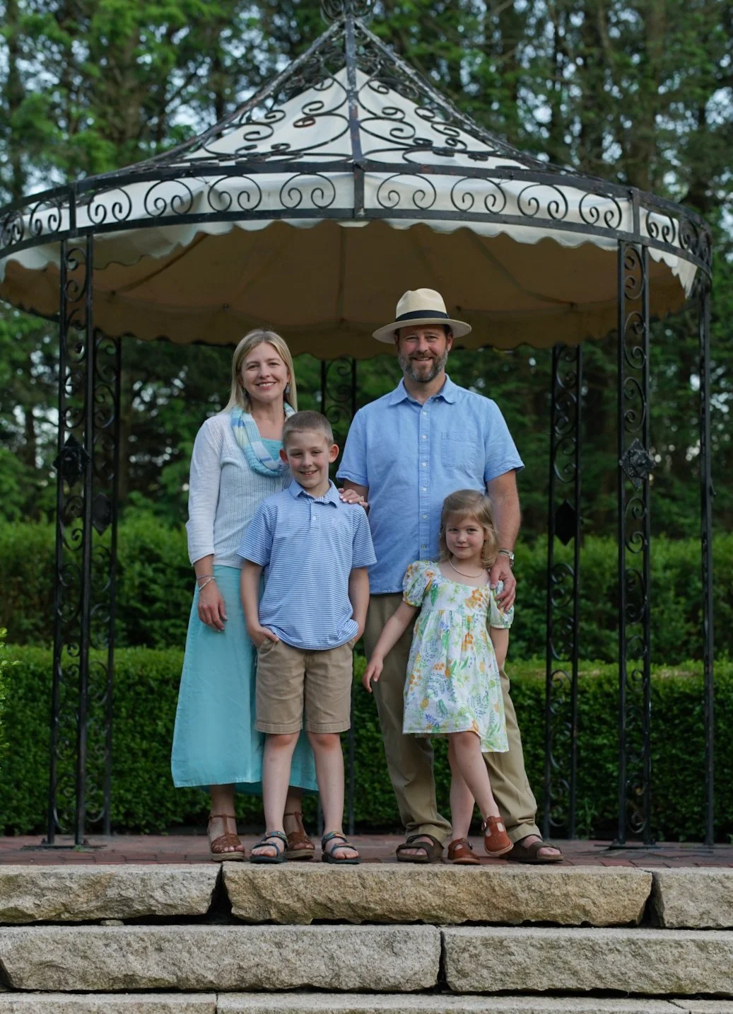 Chantelle smiling with her husband, son, and daughter