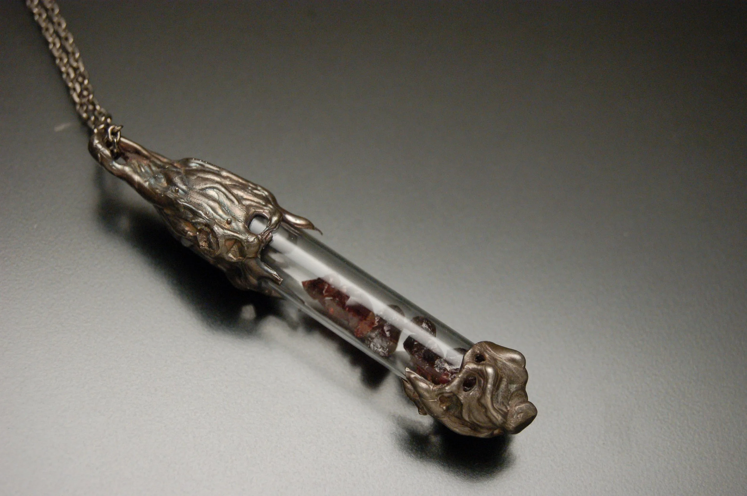 Curse of Blood- You Cannot Escape, 2012, Sterling silver, Garnet, Found glass vial
