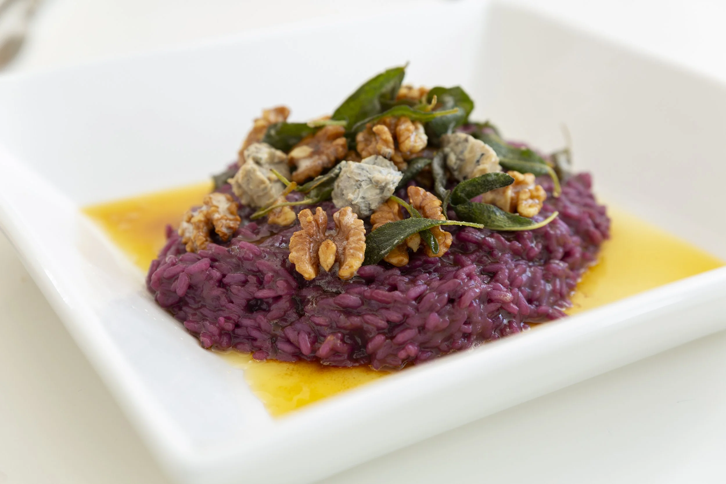 This spectacular risotto is made using Sweet Sapphire grapes, grown in Mildura. The grapes and red wine, give it a glorious colour and vibrancy. Garnished with locally grown Husk & Harvest walnuts, Welshman's reef blue vein cheese from Goldfields Far