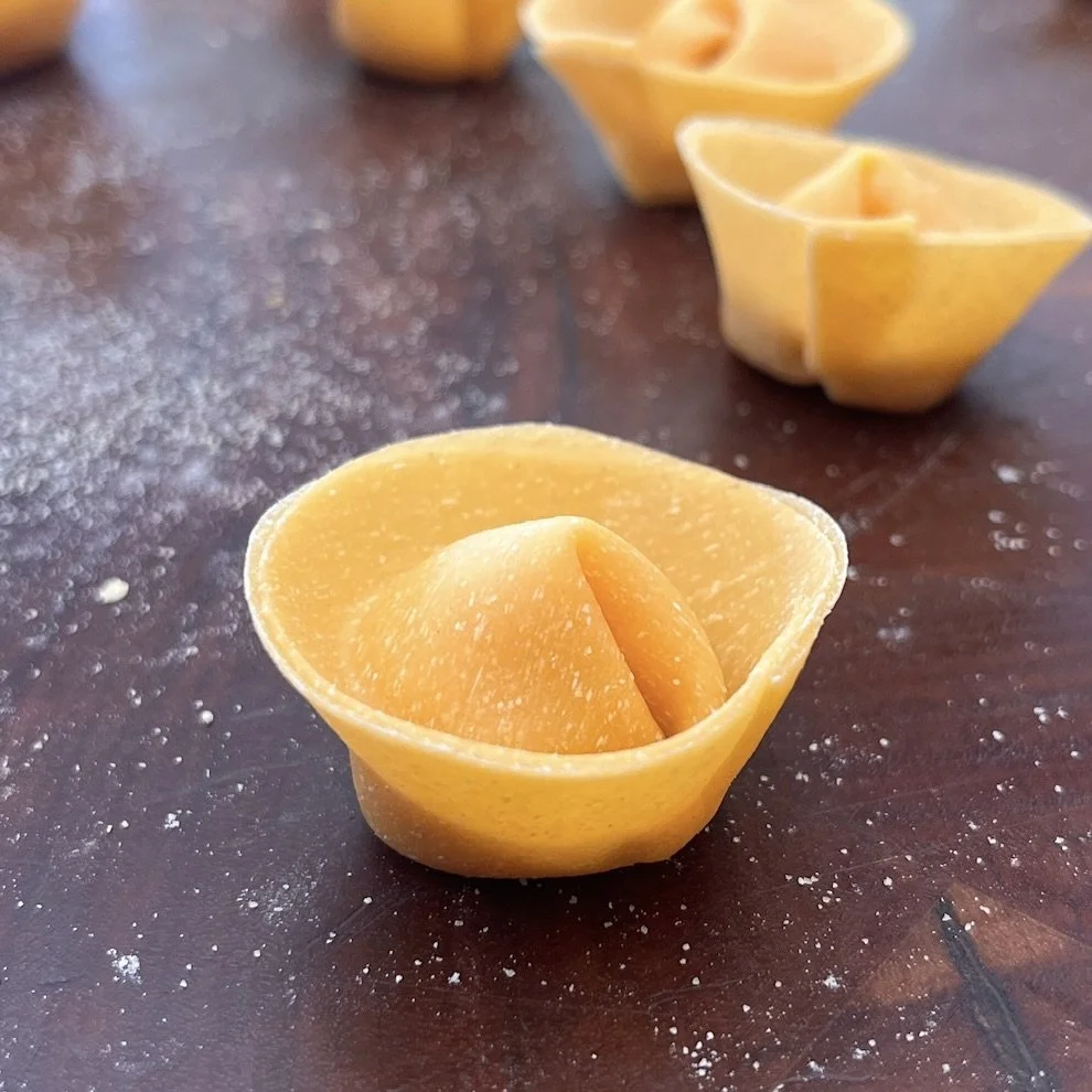 Handmade angolotti, with  a roast pumpkin filling.
