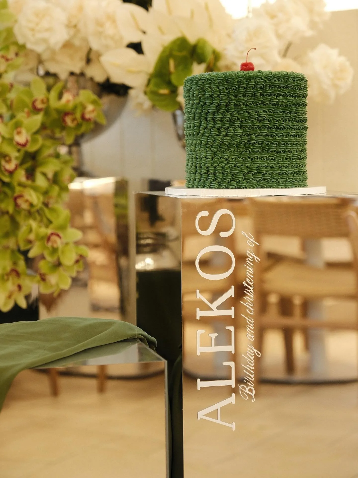 Olive hues, soft green tones, and mirrored accents catching every fleeting light &mdash; a day wrapped in quiet elegance.

Alekos, one year of wonder.
A baptism, a beginning.

Surrounded by his favourite people, held in love, and dressed in moments t