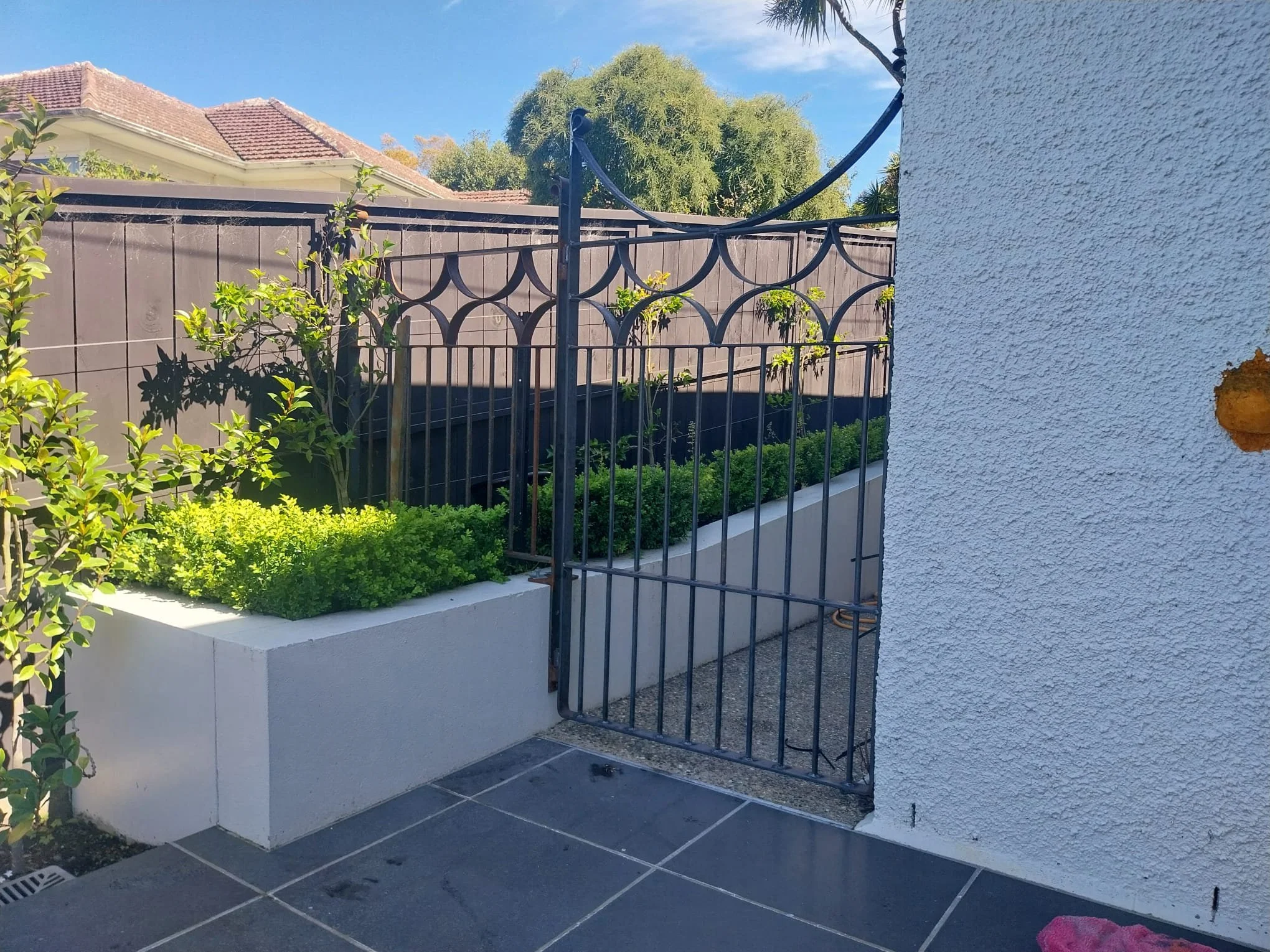 Custom designed feature gates for a Dunedin home. Metal, powder coated, and designed to match the features throughout the house.