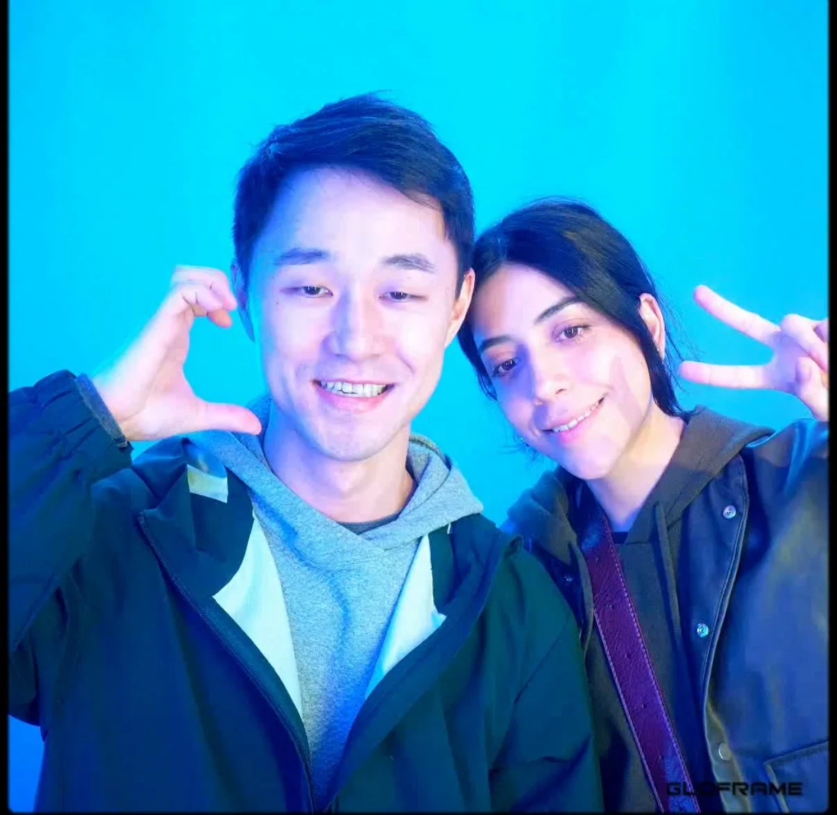Two guests smiling and posing together in The 1881 Studio photo booth.