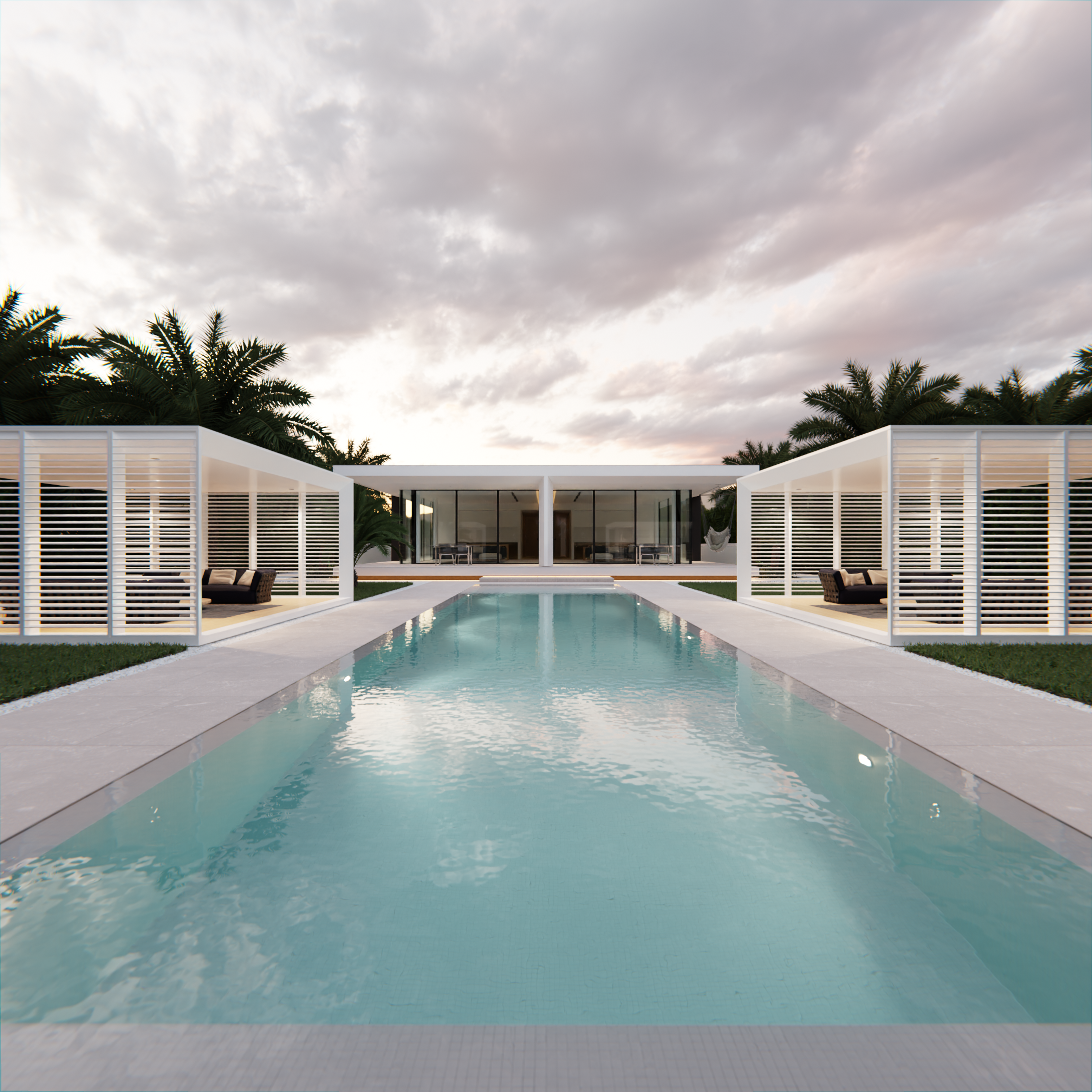 Piscina rettangolare con acqua blu, circondata da un'area con piante di palma e sedie a sdraio. Strutture architettoniche moderne con pareti bianche e pareti di vetro riflettente sullo sfondo, sotto un cielo nuvoloso.