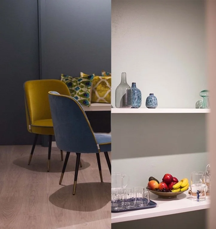 The intimate lounge at Phaedra Pilates studio in Lugano offers comfortable seating and a refreshment area with fresh fruit, water and coffee.