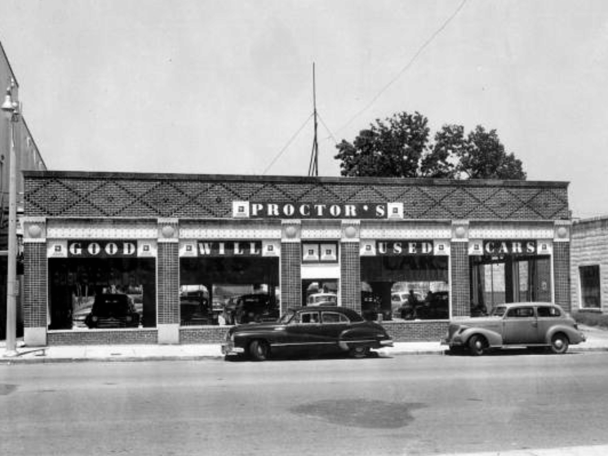 Proctor's used car showroom on Monroe Street between Park & Call