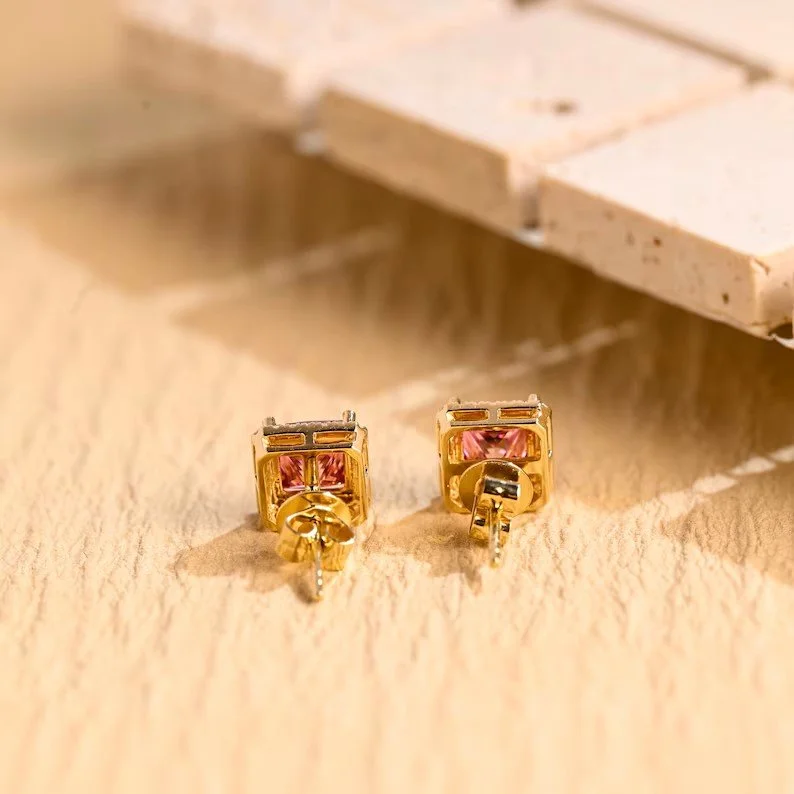 Pink gemstone stud earrings with diamond halo