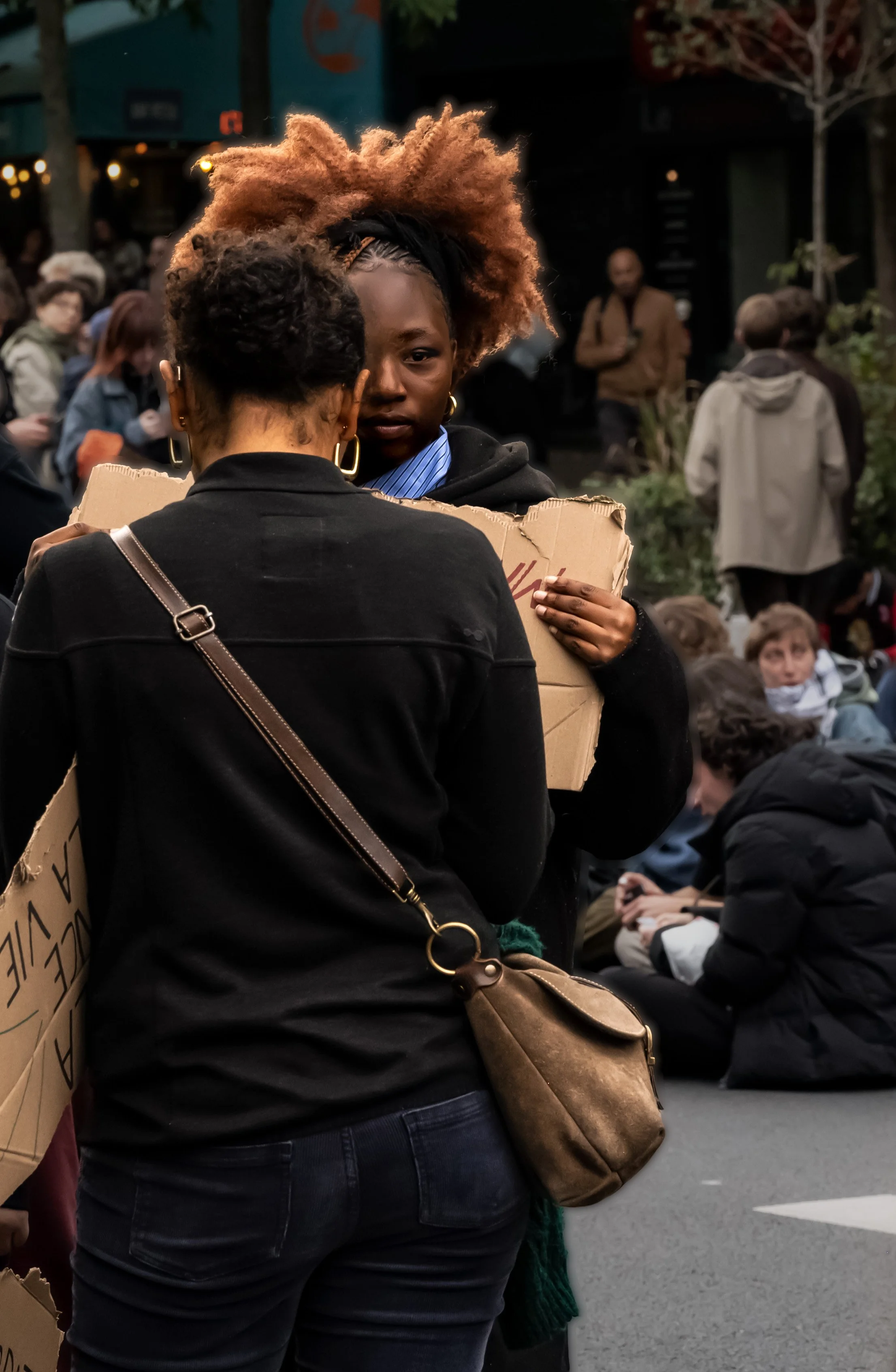 Single Eye Sister Holding Sign.jpg