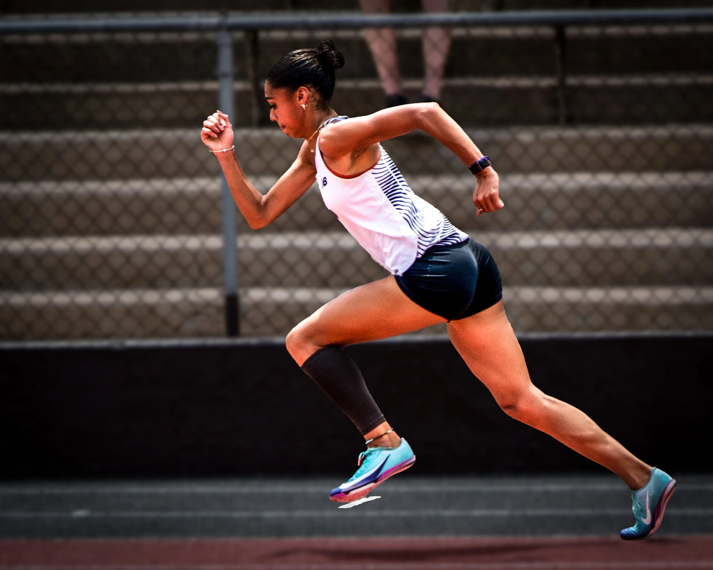 Female Student Running on Track.jpg