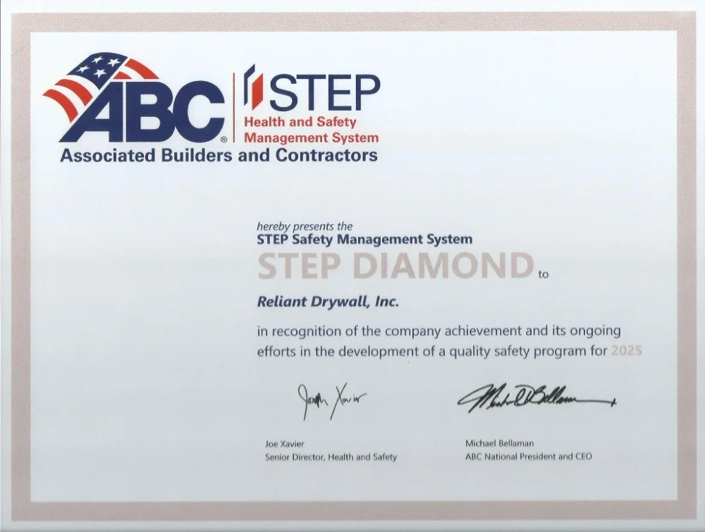 Certificate from ABC Associated Builders and Contractors, recognizing Reliant Drywall, Inc. for achieving the STEP DIAMOND Safety Management System award for 2025, signed by Joe Xavier and Michael Bellaman.