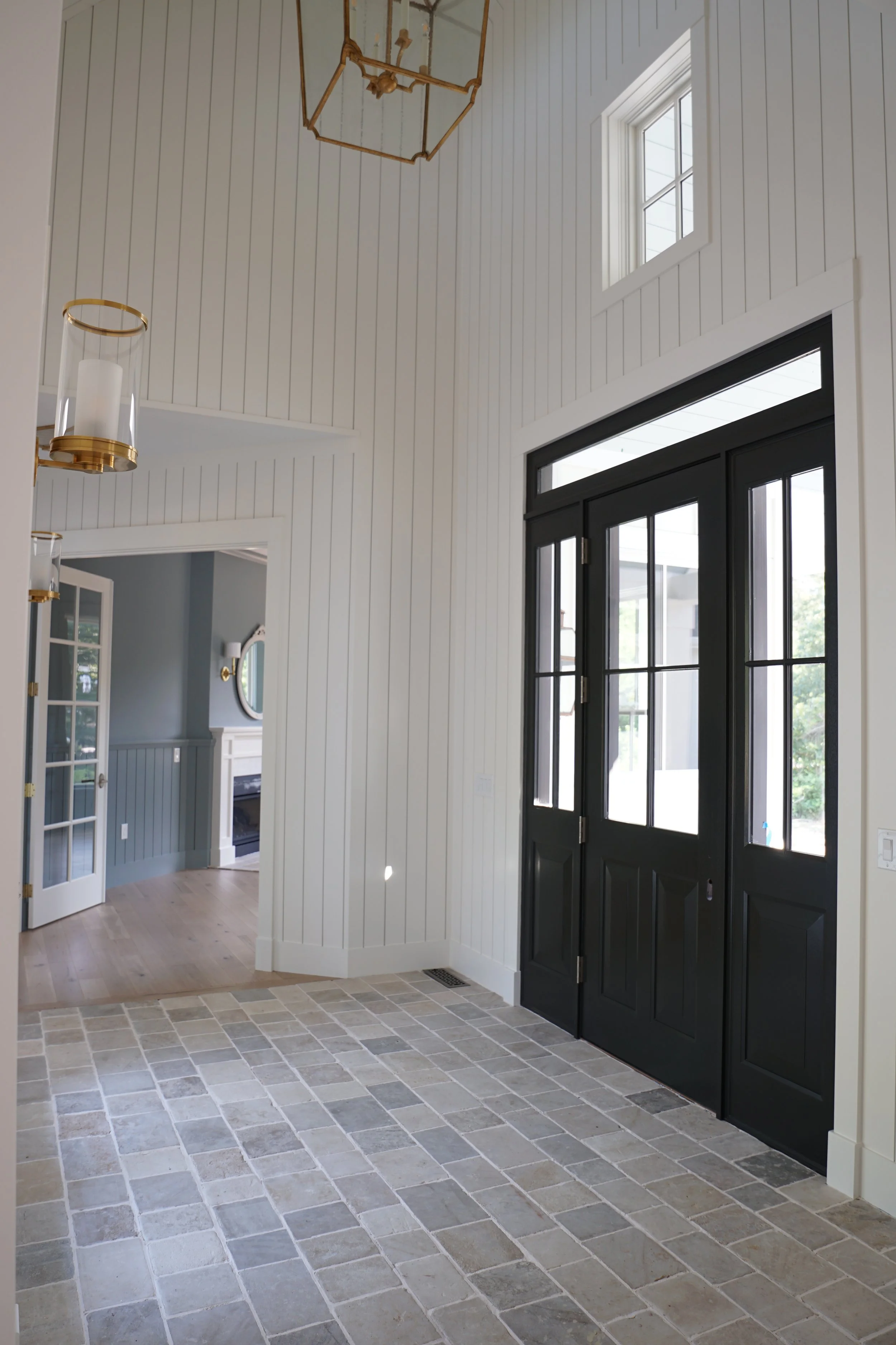 Luxury Rhode Island coastal home by Spinazzola Interiors featuring European farmhouse architecture, custom millwork and timeless coastal interiors.