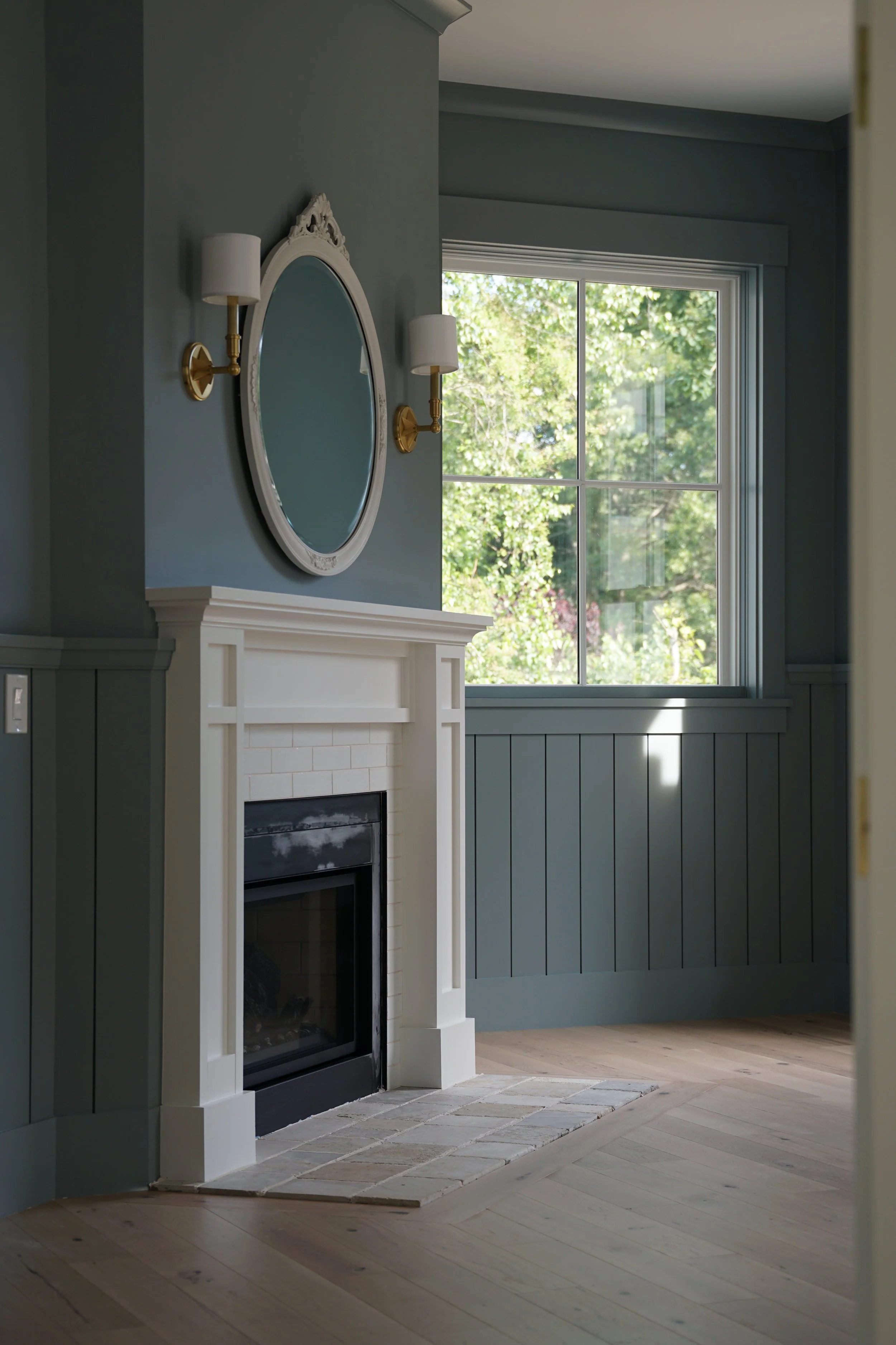 Luxury Rhode Island coastal home by Spinazzola Interiors featuring European farmhouse architecture, custom millwork and timeless coastal interiors.