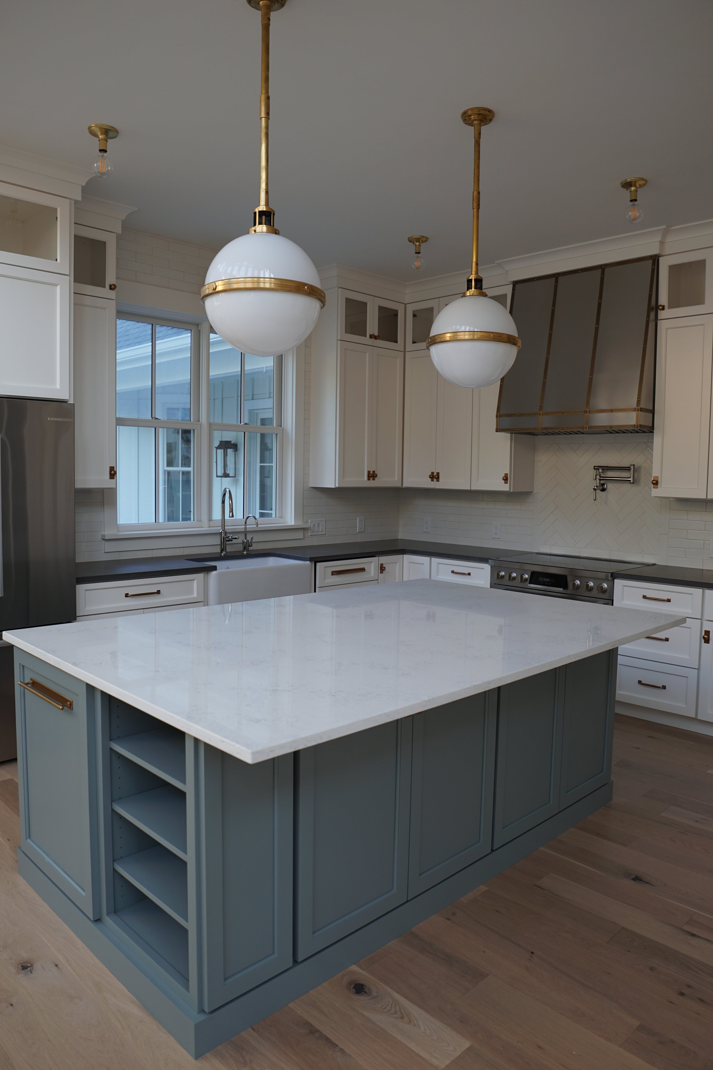 Luxury Rhode Island coastal home by Spinazzola Interiors featuring European farmhouse architecture, custom millwork and timeless coastal interiors.