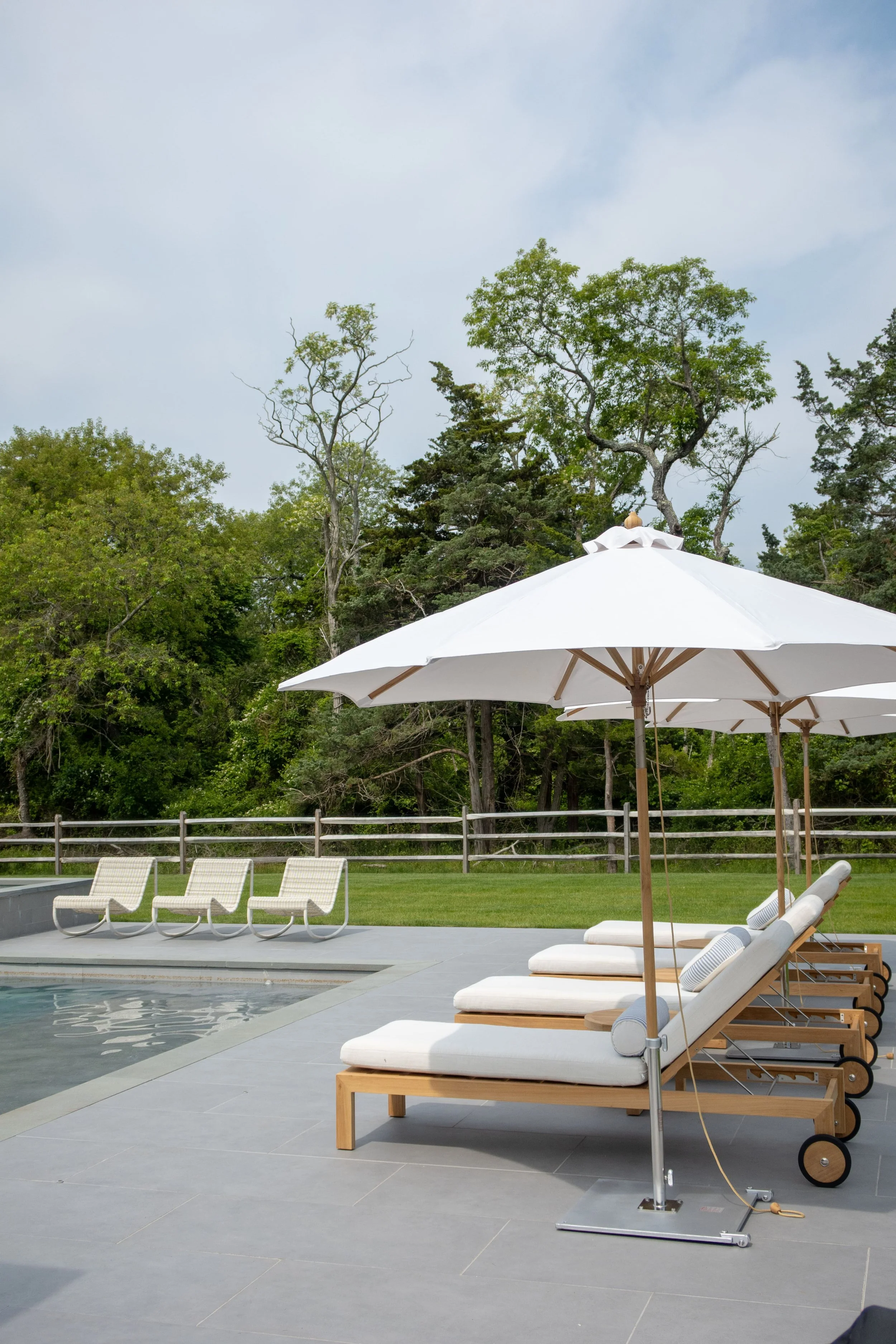 Hamptons coastal home designed by Spinazzola Interiors featuring reclaimed wood beams, handcrafted finishes and timeless luxury interiors.