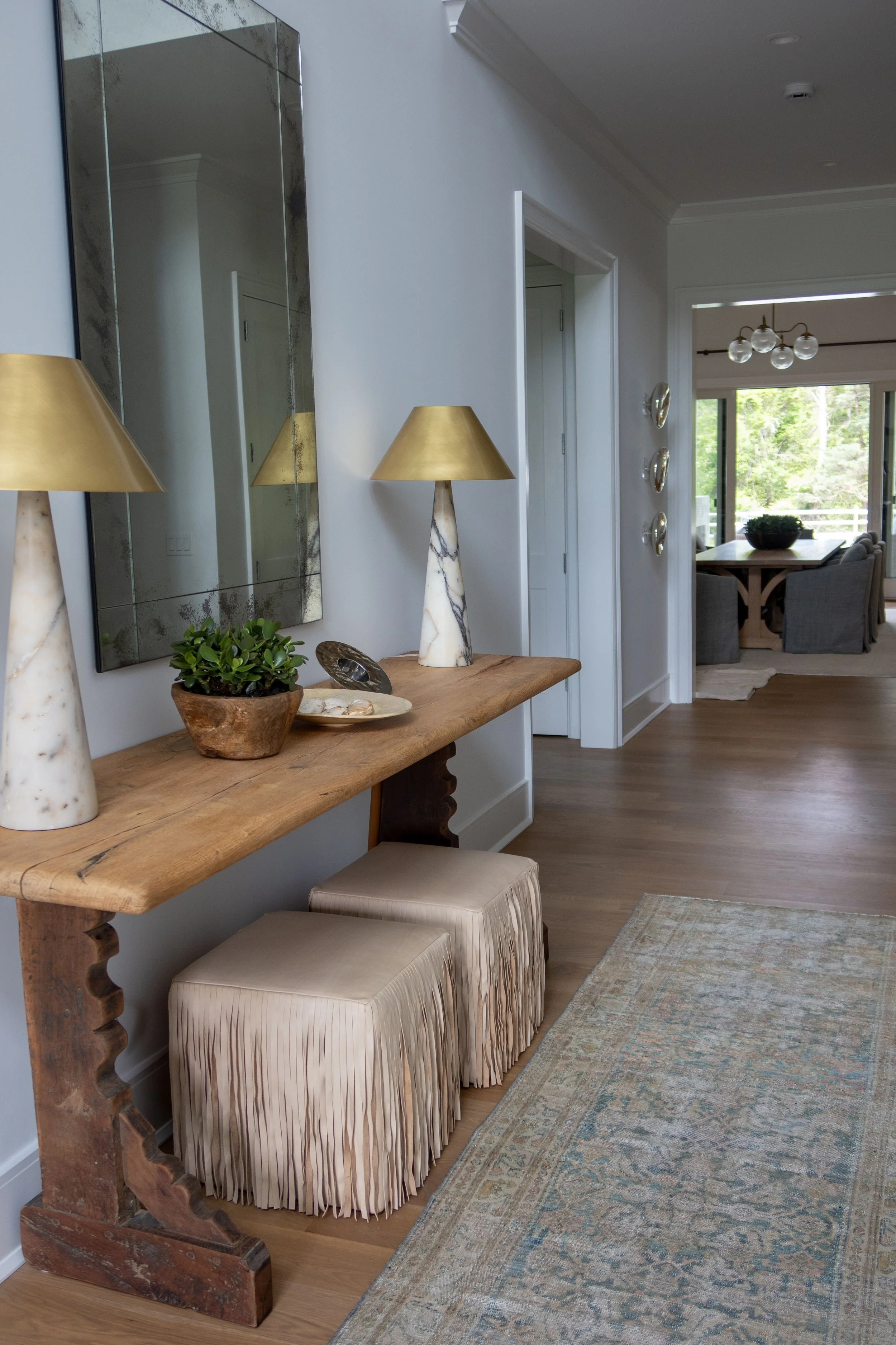 Hamptons coastal home designed by Spinazzola Interiors featuring reclaimed wood beams, handcrafted finishes and timeless luxury interiors.
