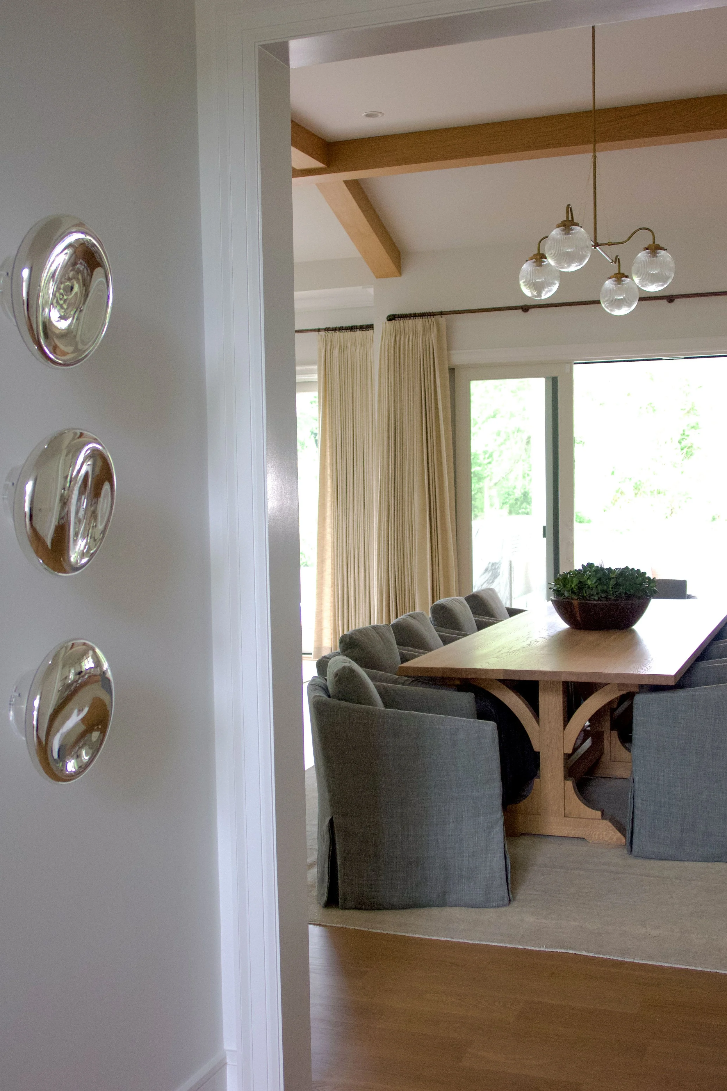 Hamptons coastal home designed by Spinazzola Interiors featuring reclaimed wood beams, handcrafted finishes and timeless luxury interiors.