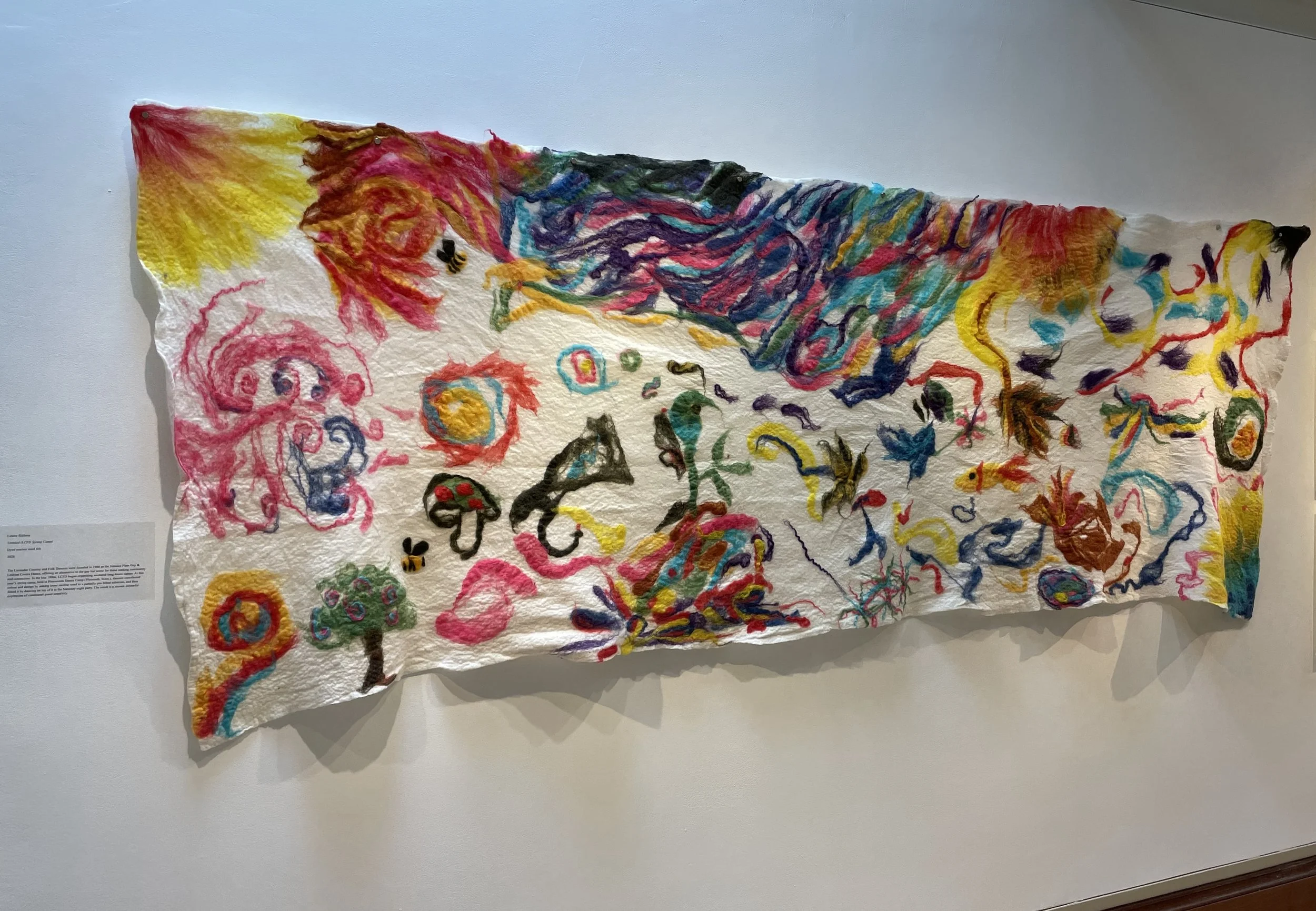 Untitled (LCFD Spring Camp), collaborative felted banner, 2026. Merino wool, approx 40 x 108 inches. Installation view. This work is in the collection of Emmanuel College, Boston, USA.