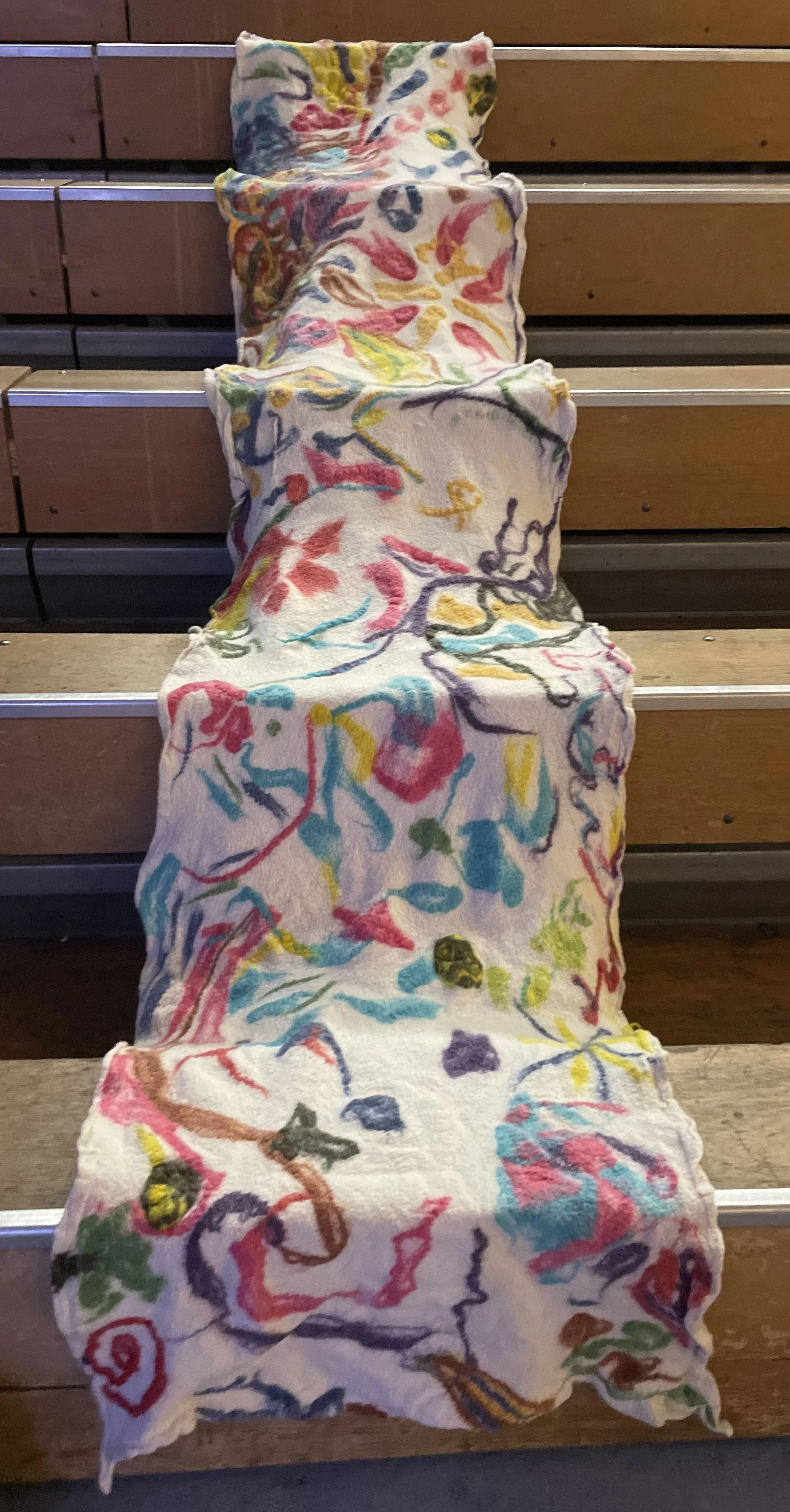 Untitled (Contra Camp), collaborative felted banner, 2026. Merino wool, approx 40 x 200 inches. Installation variable.