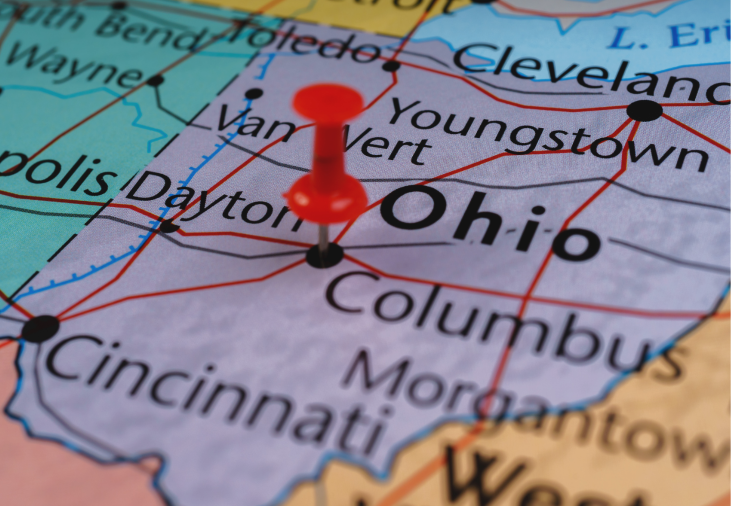 Close-up of a map of Ohio with a red pushpin marking Dayton.