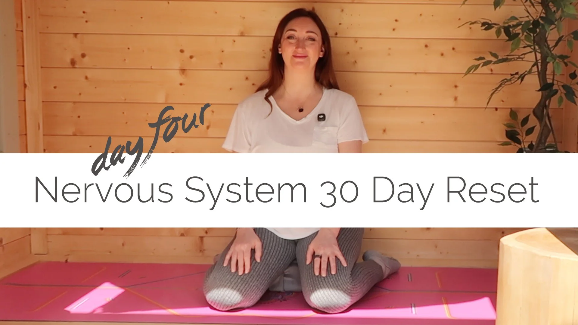 Woman practicing yoga in a wooden room, titled 'Day Four: Nervous System 30 Day Reset'.
