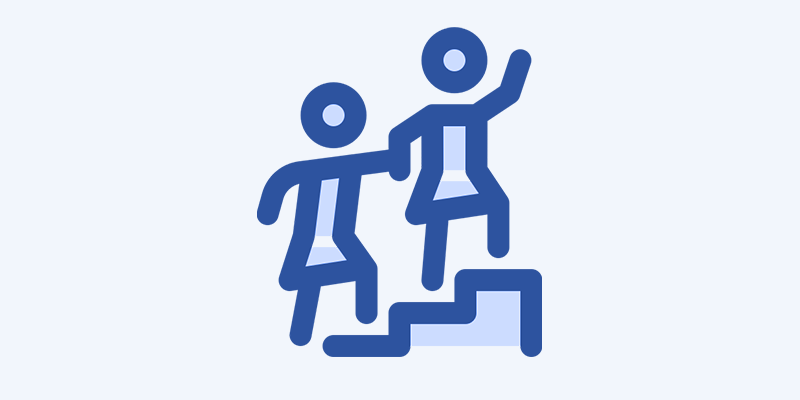 Two stylized figures of a person helping another person up a step, symbolizing support or guidance.