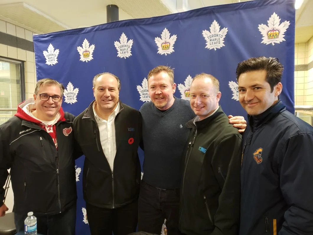 	
Mayor Steve Pellegrini standing together in front of a Toronto Maple Leafs themed backdrop, smiling.
