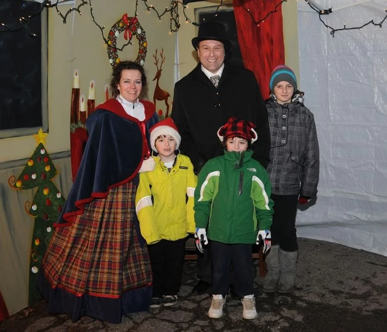  	
	
Mayor Steve Pellegrini dressed in Christmas attire posing for a photo in a decorated holiday setting. 